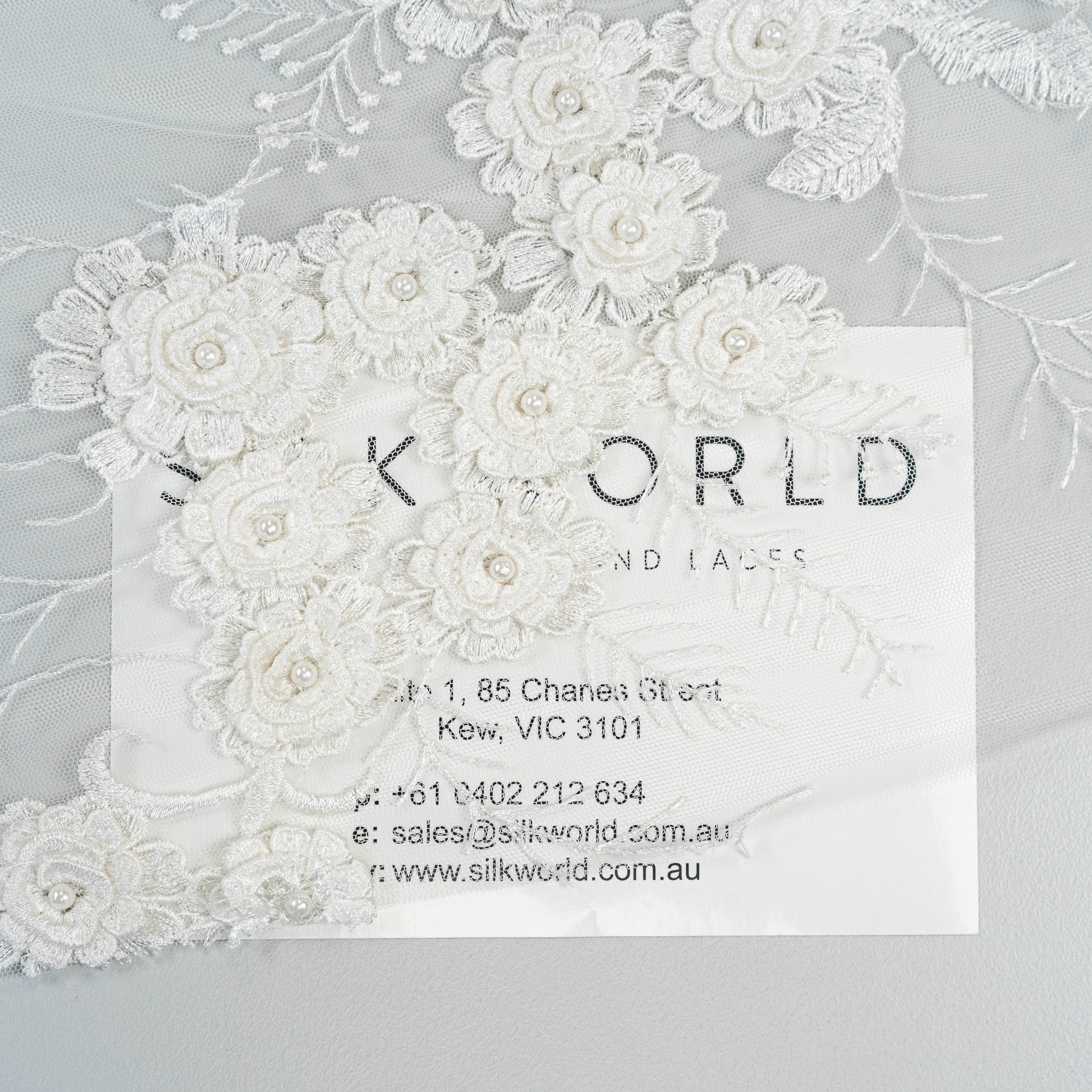 Ivory Embroidered 3D Tulle — featuring floral motifs, a 3D floral design and hand-beading, 50% nylon 50% rayon, 140cm wide