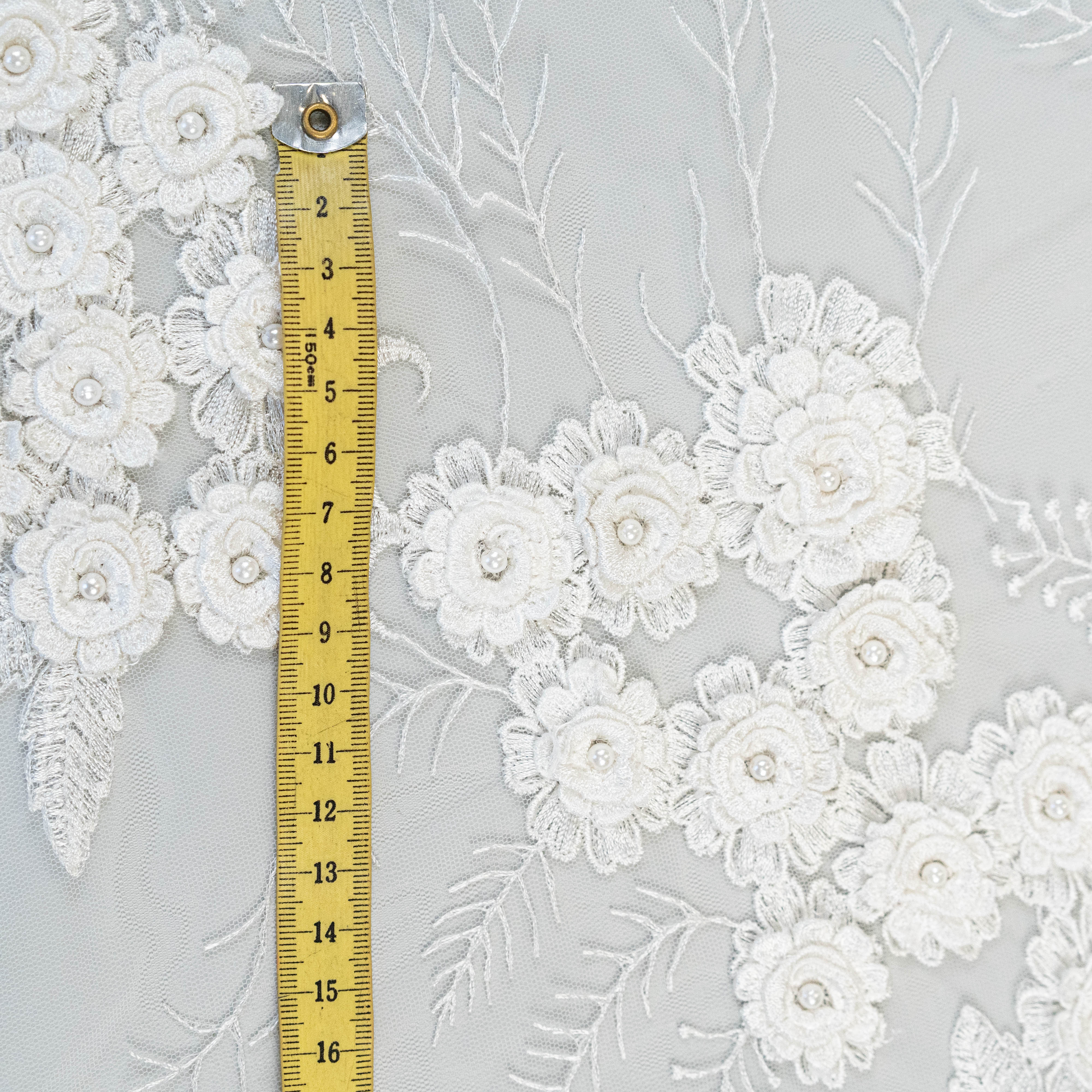 Ivory Embroidered 3D Tulle — featuring floral motifs, a 3D floral design and hand-beading, 50% nylon 50% rayon, 140cm wide
