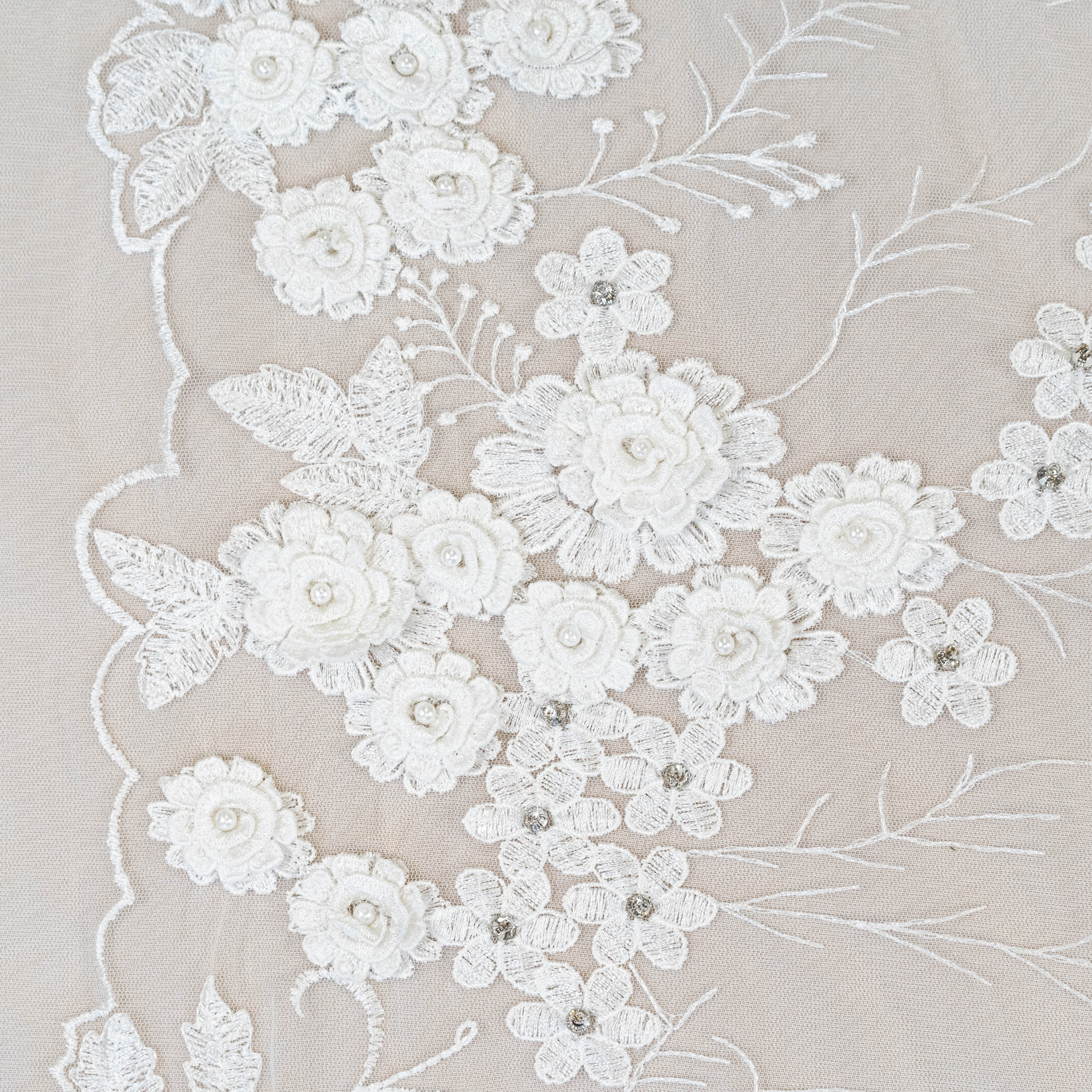 Ivory Embroidered 3D Tulle — featuring floral motifs, a 3D floral design and hand-beading, 50% nylon 50% rayon, 140cm wide