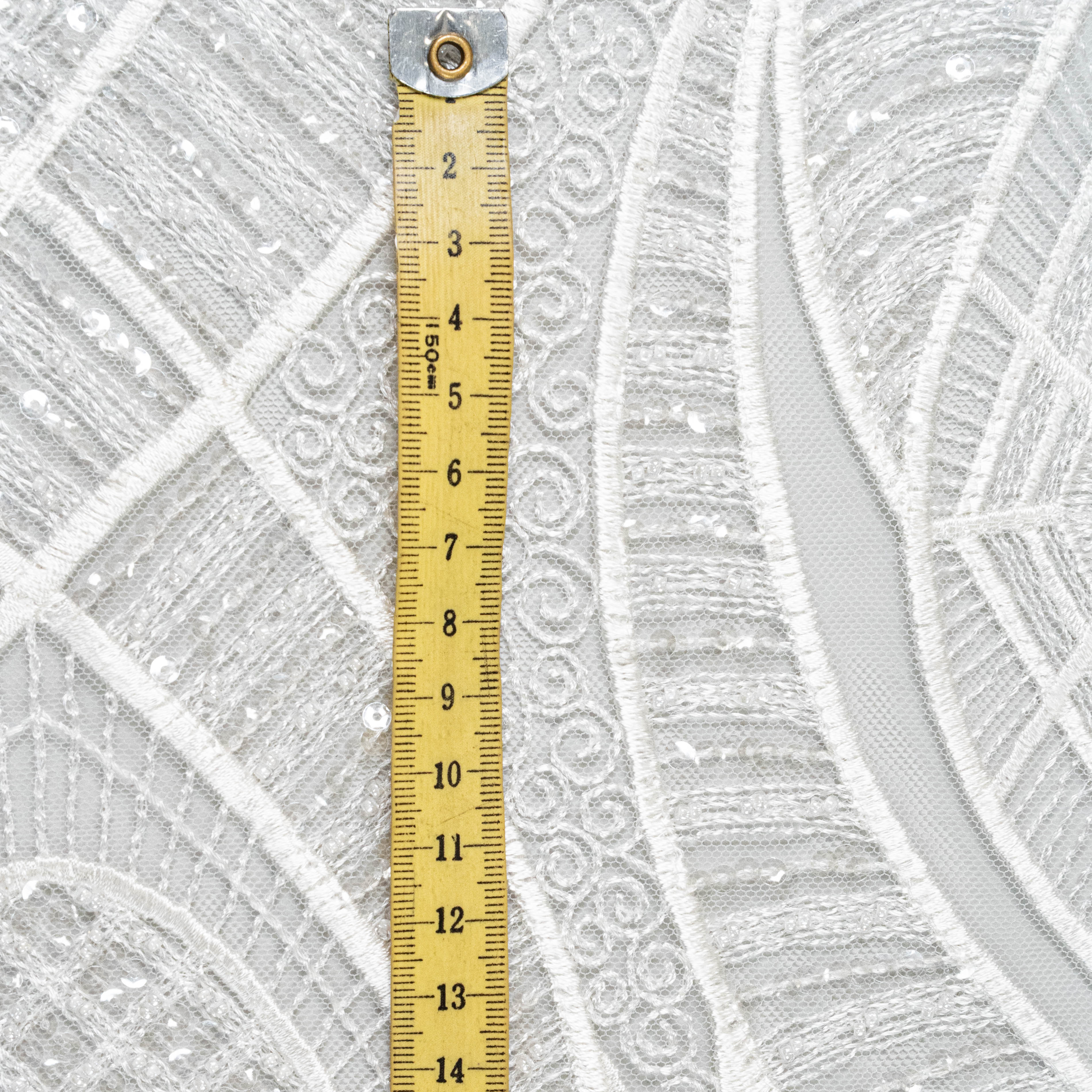 Ivory Embellished Tulle — featuring scalloped edges and hand-beading, 50% nylon 50% rayon, 130cm wide