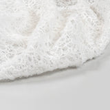 Off White Elastic Crushed Tulle — featuring a crushed texture, 100% nylon, 50cm wide