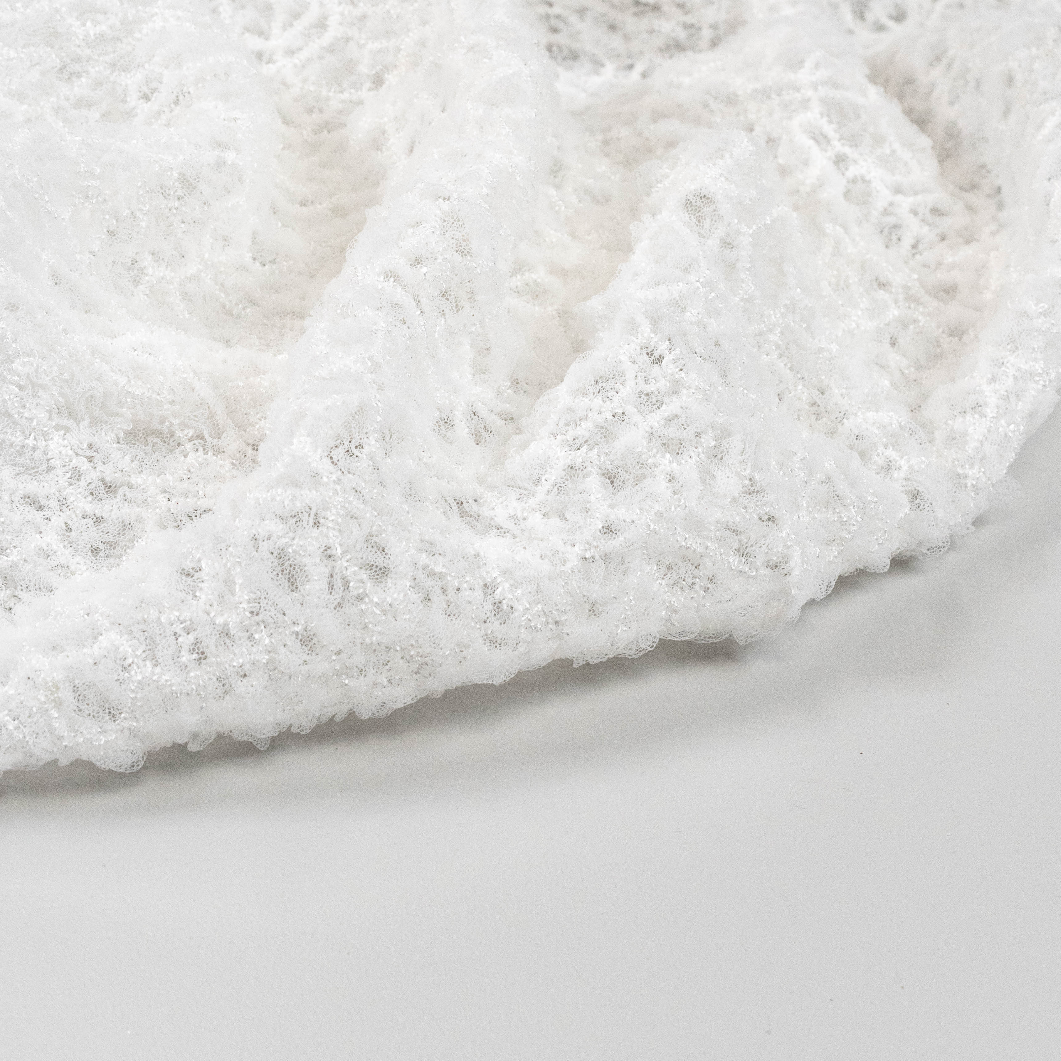 Off White Elastic Crushed Tulle — featuring a crushed texture, 100% nylon, 50cm wide
