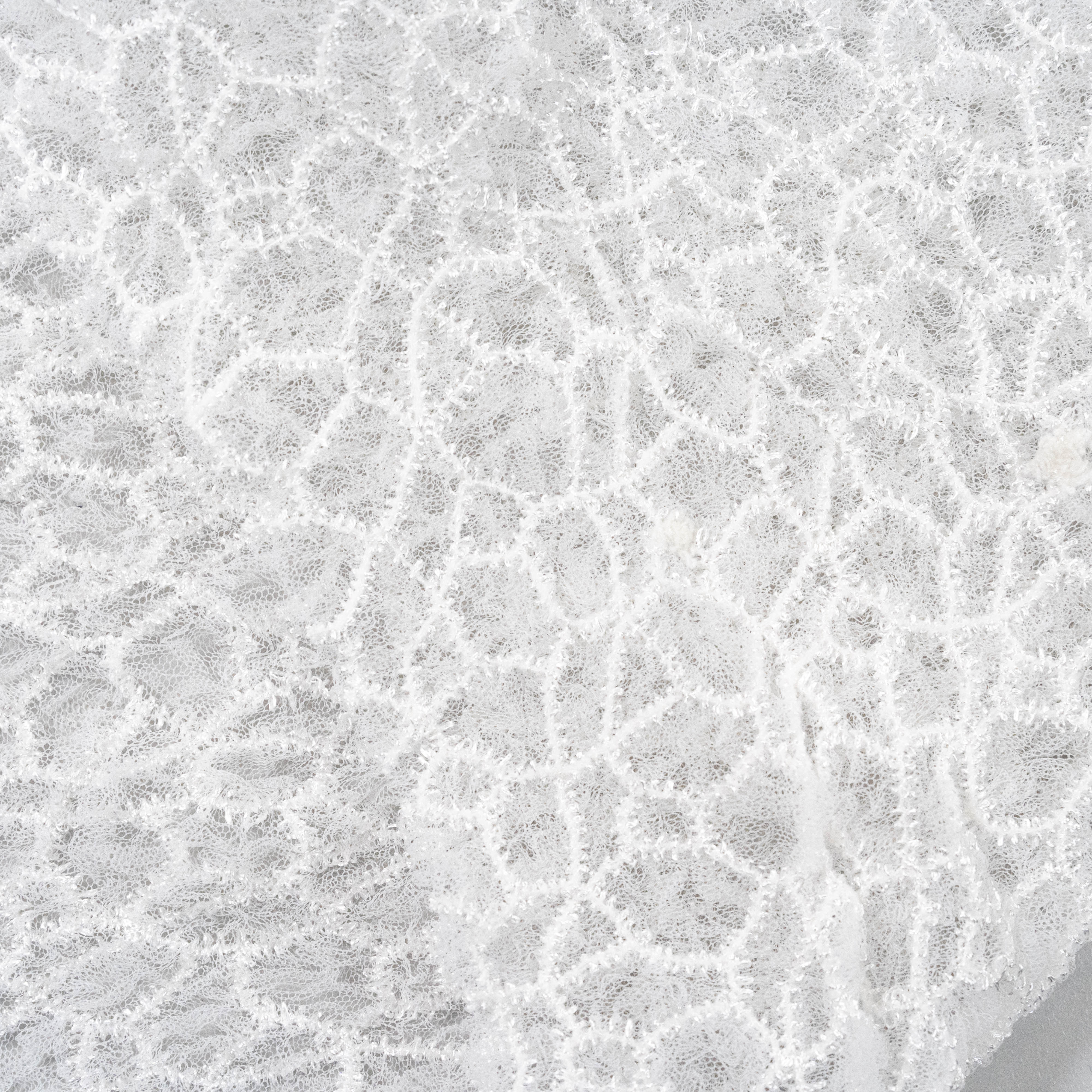 Off White Elastic Crushed Tulle — featuring a crushed texture, 100% nylon, 50cm wide