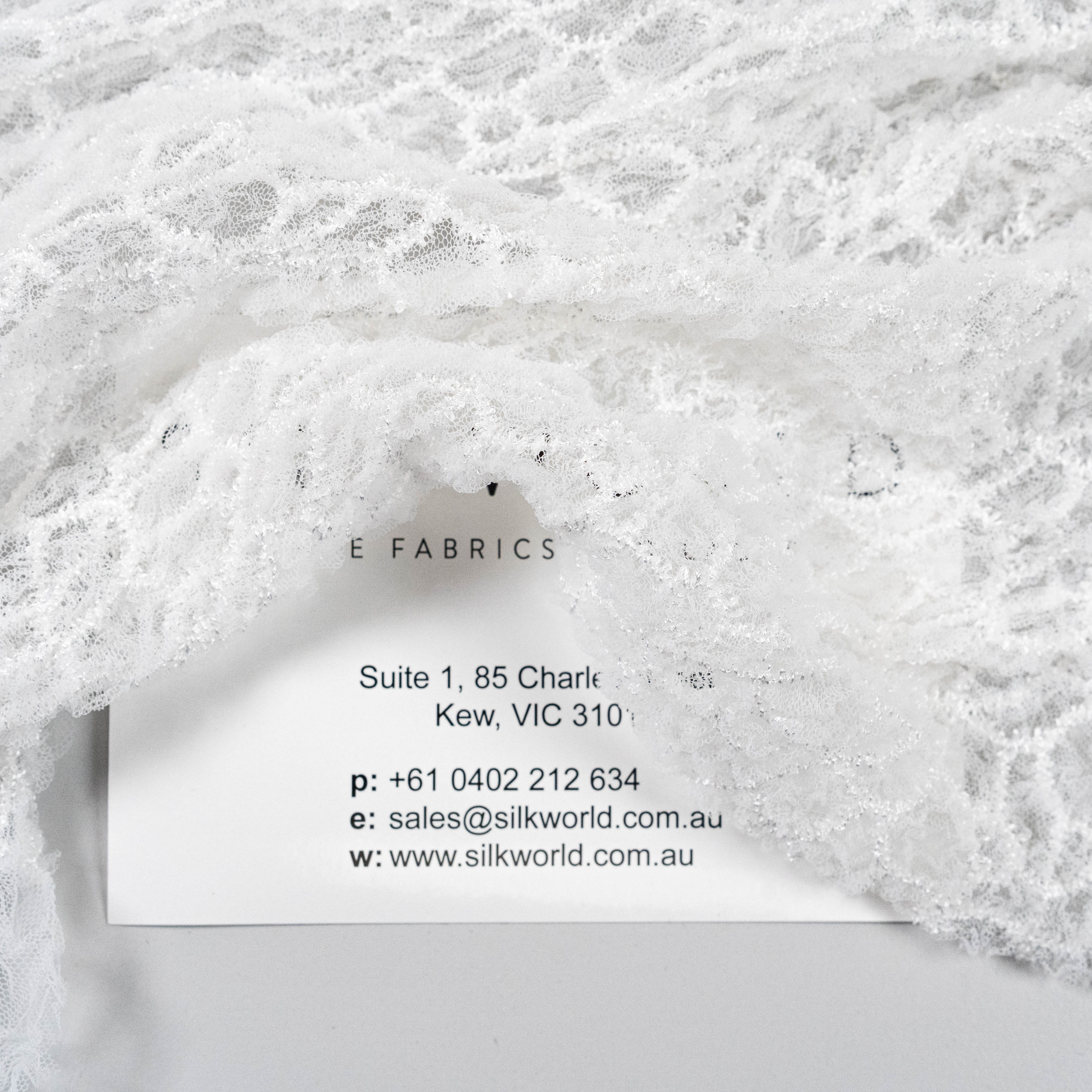 Off White Elastic Crushed Tulle — featuring a crushed texture, 100% nylon, 50cm wide
