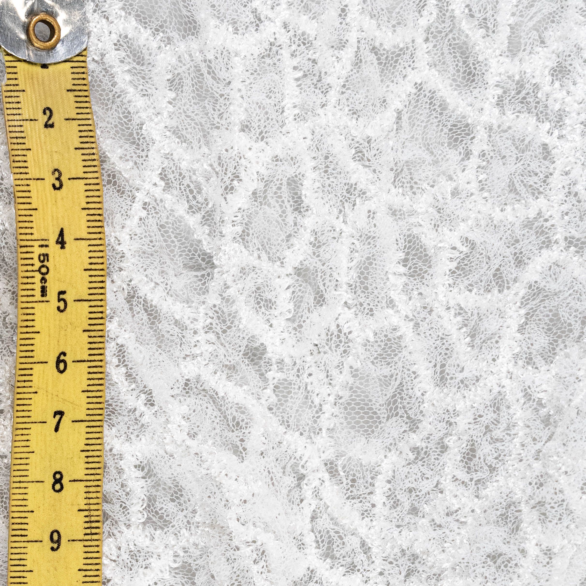 Off White Elastic Crushed Tulle — featuring a crushed texture, 100% nylon, 50cm wide
