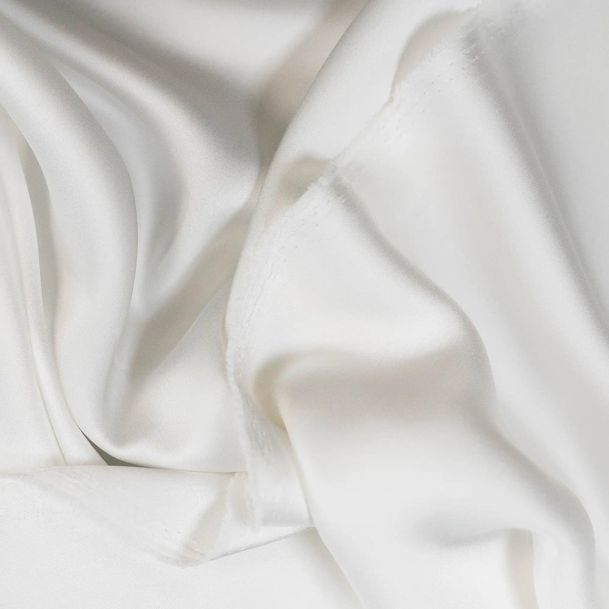 Ivory Faux Acetate Satin — mid-weight double-faced polyester satin with a delustered finish, fluid drape and slight stretch