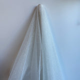 Off White / Silver Glitter Tulle — lightweight and soft, 100% nylon, 150cm wide