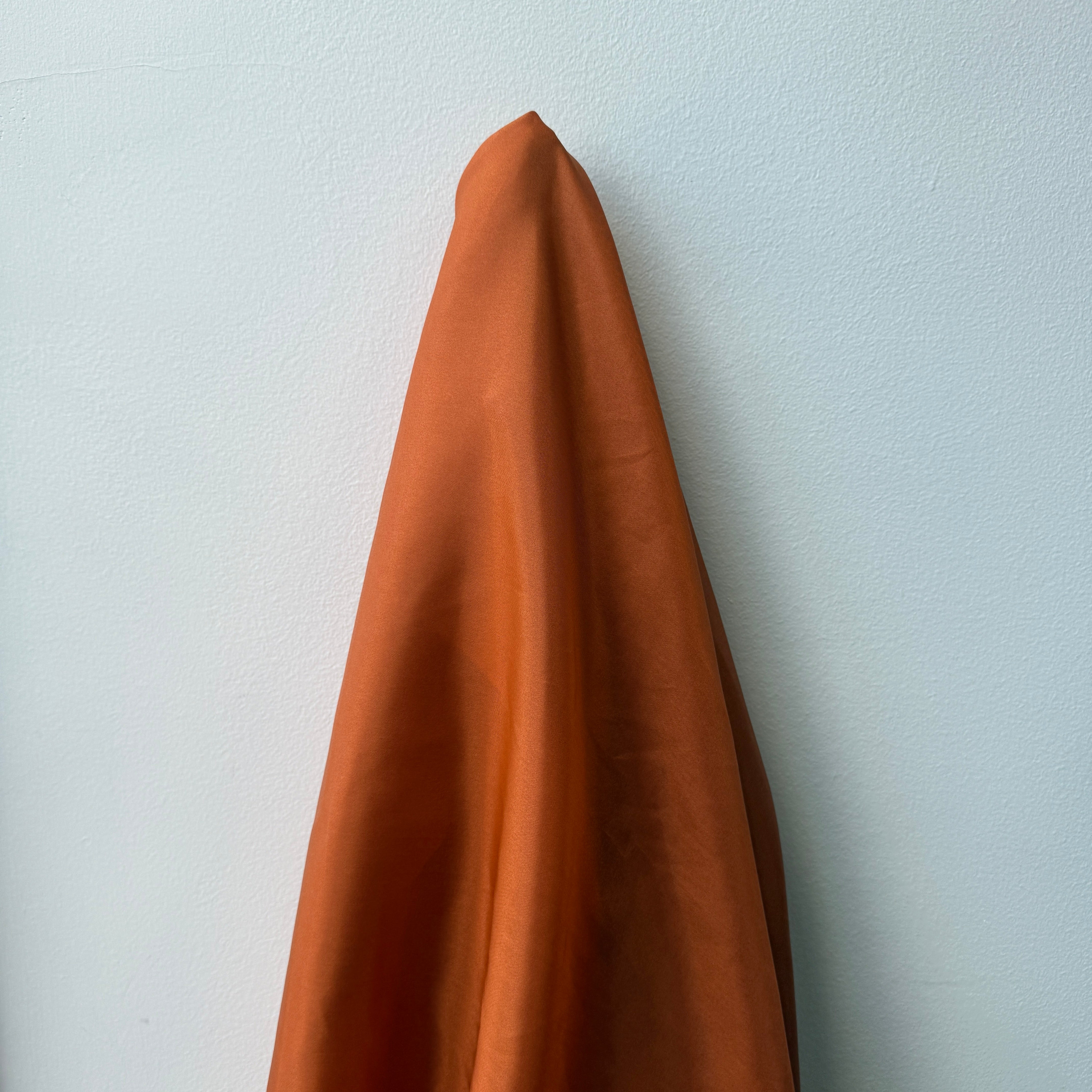 Burnt Orange Habotai — soft with a light, airy drape and a smooth satin finish, 100% mulberry silk, 140cm wide