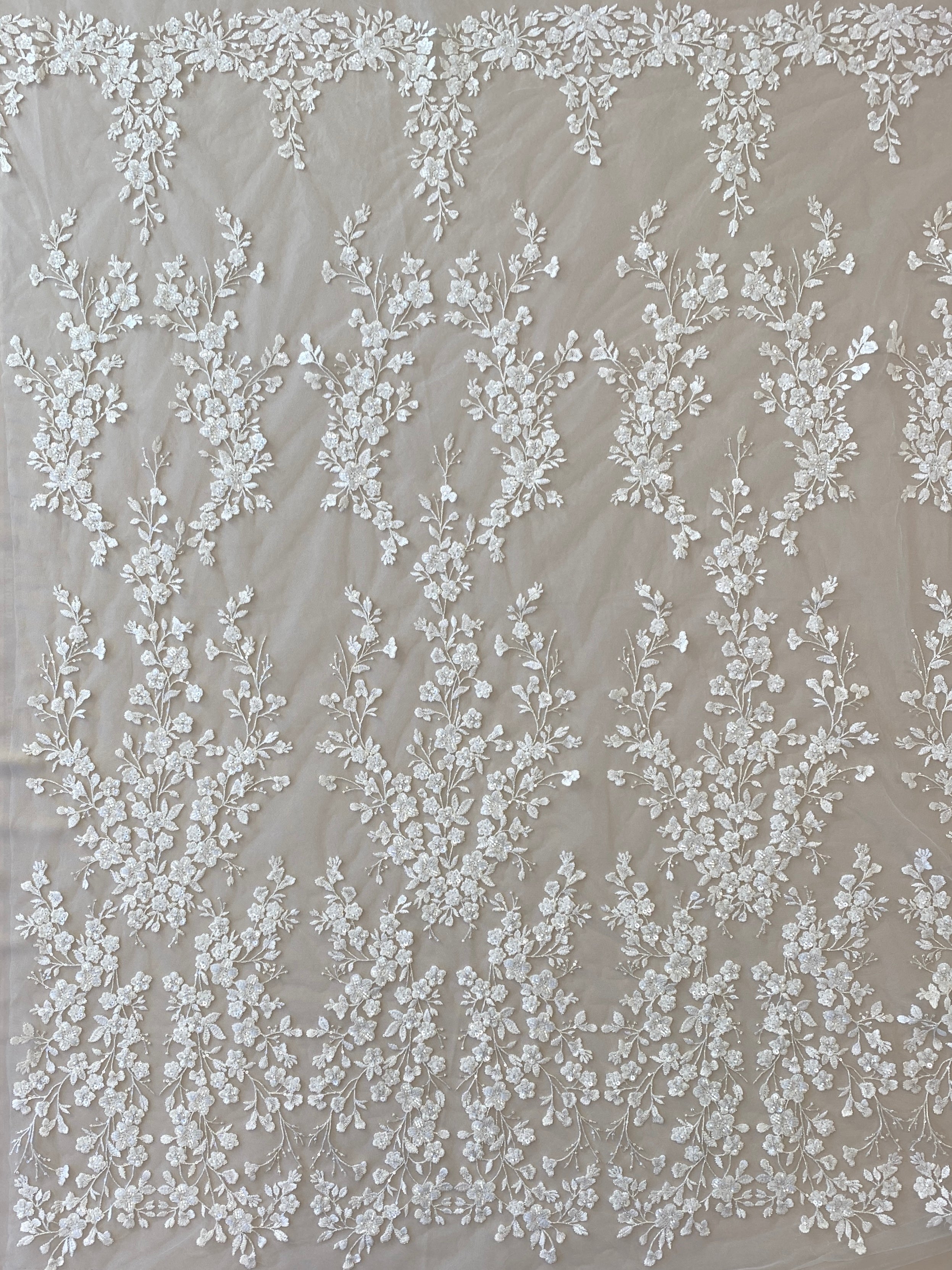 Ivory / Silver Embellished Floral Tulle — featuring floral motifs, hand-beading and sequins, 60% rayon 40% nylon, 140cm wide