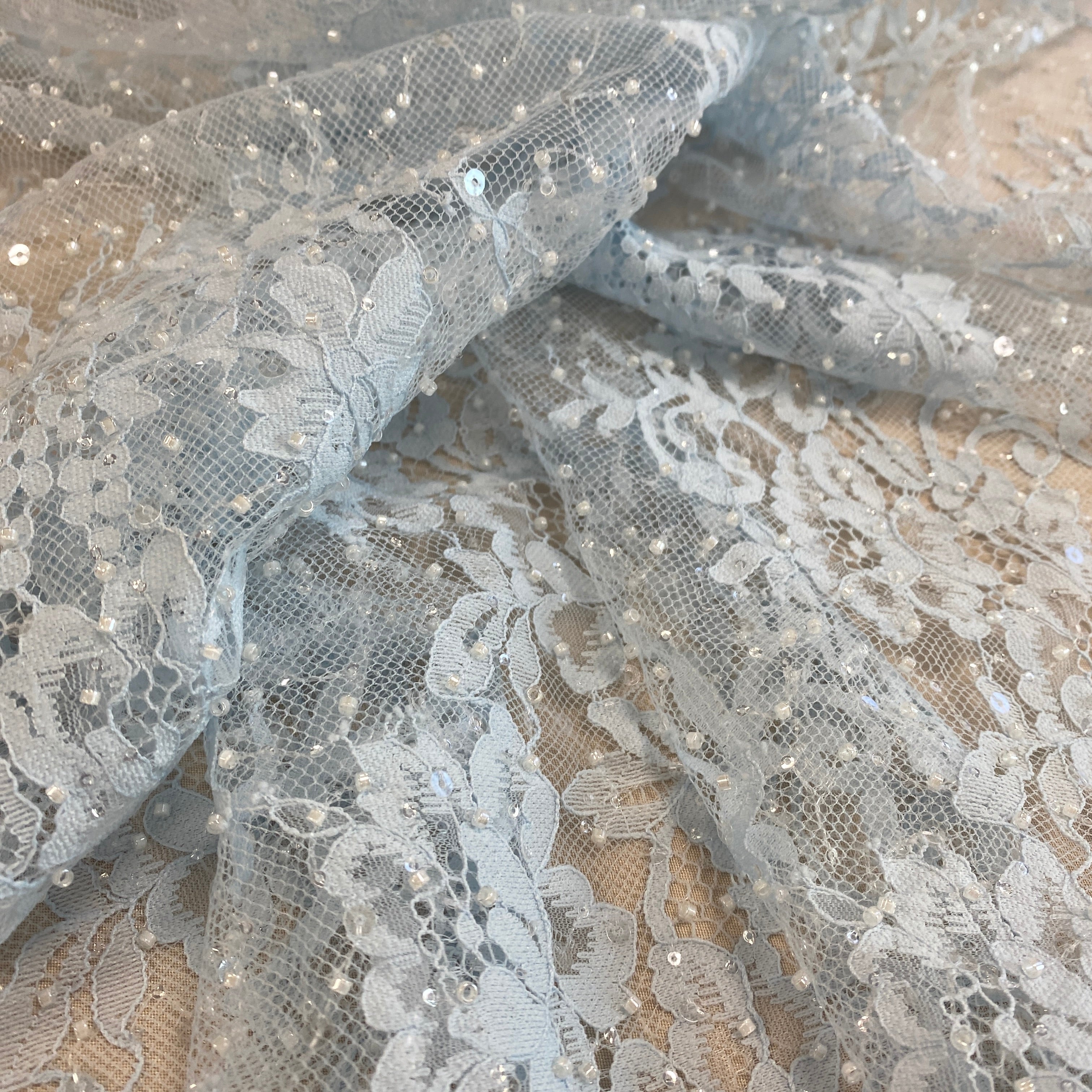 Baby Blue Beaded Fine Lace — featuring scalloped edges, eyelash detail and floral motifs, in nylon and viscose, 130cm wide