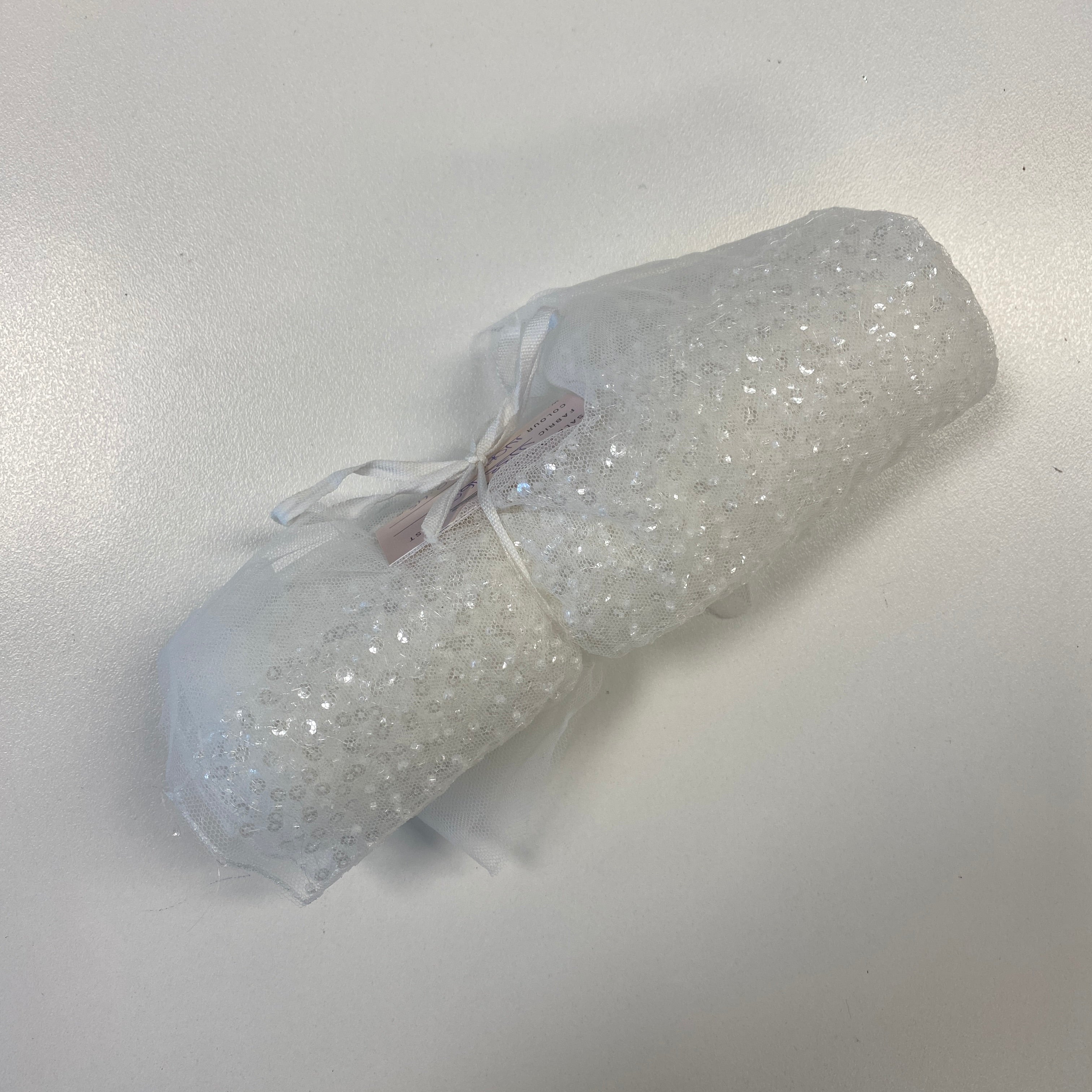 Ivory Sequin Tulle — featuring hand-beading and sequins, 100% nylon, 110cm wide