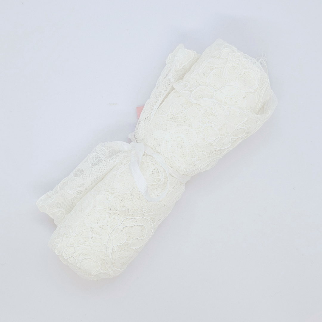 Ivory Fine Chantilly lace — featuring scalloped edges, eyelash detail and floral motifs, in viscose, 135cm wide