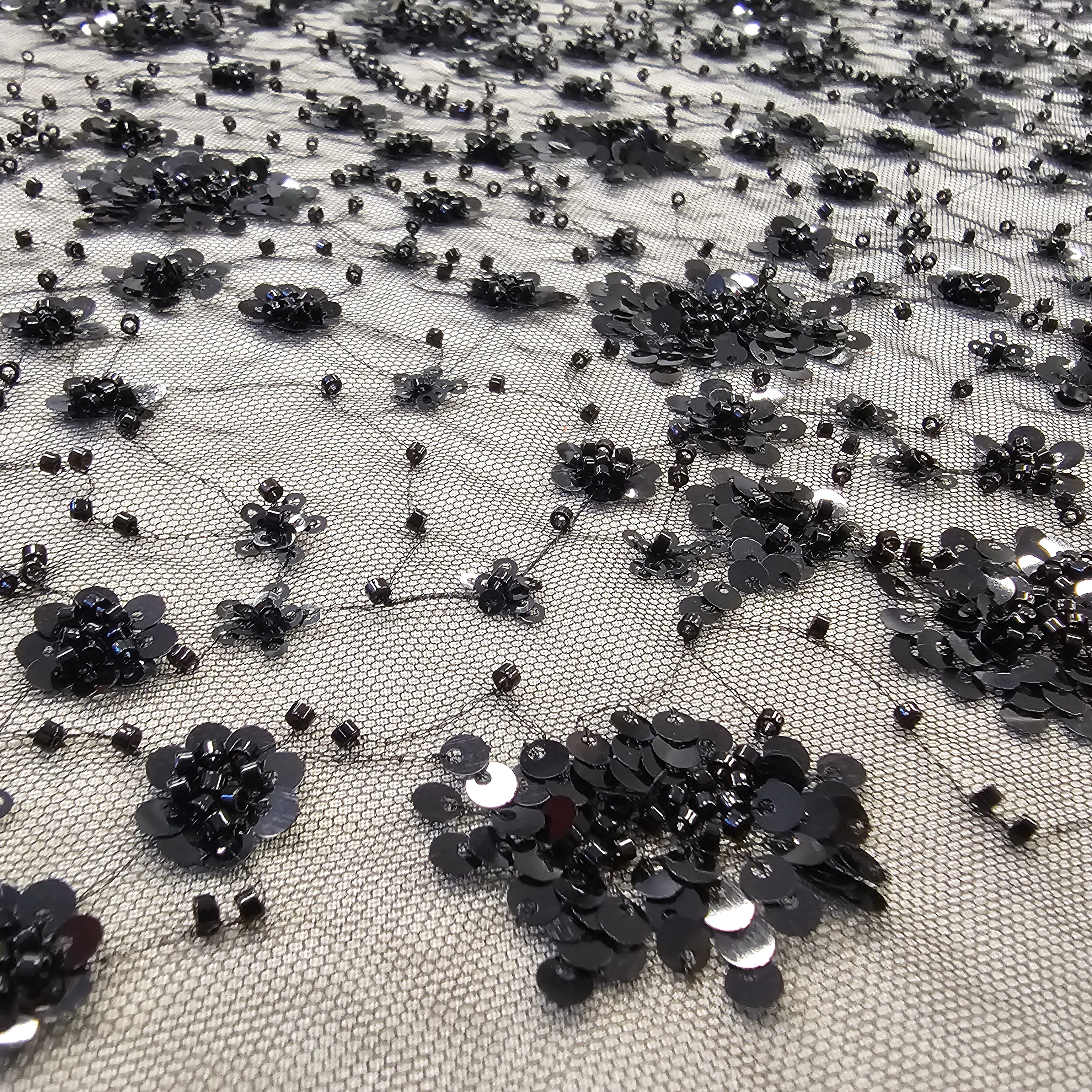 Black Sequin Tulle — featuring hand-beading and sequins, 50% rayon 50% nylon, 130cm wide