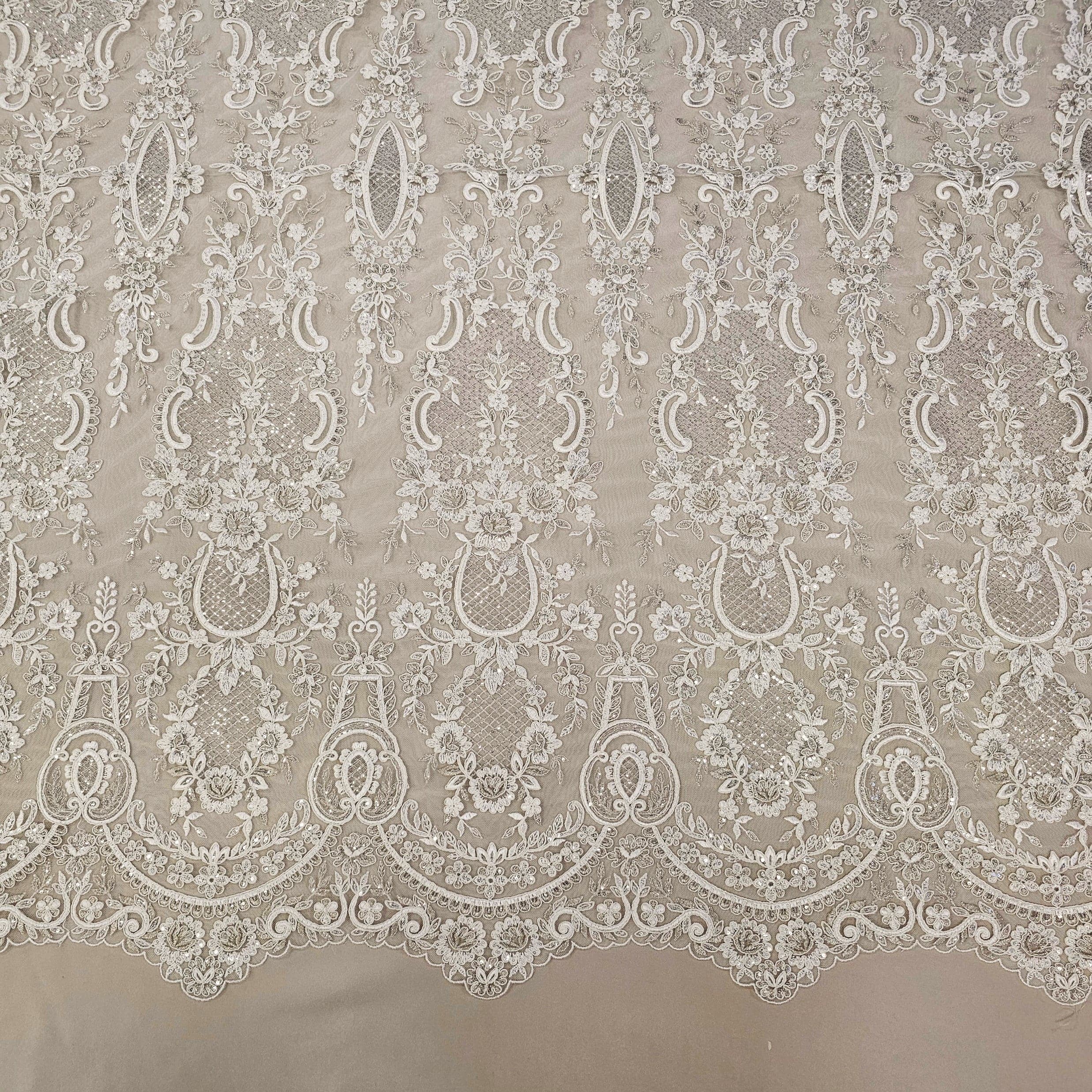 Ivory / Silver Embroidered Corded Tulle — featuring scalloped edges, a corded texture and sequins, 50% nylon 50% rayon, 130cm wide