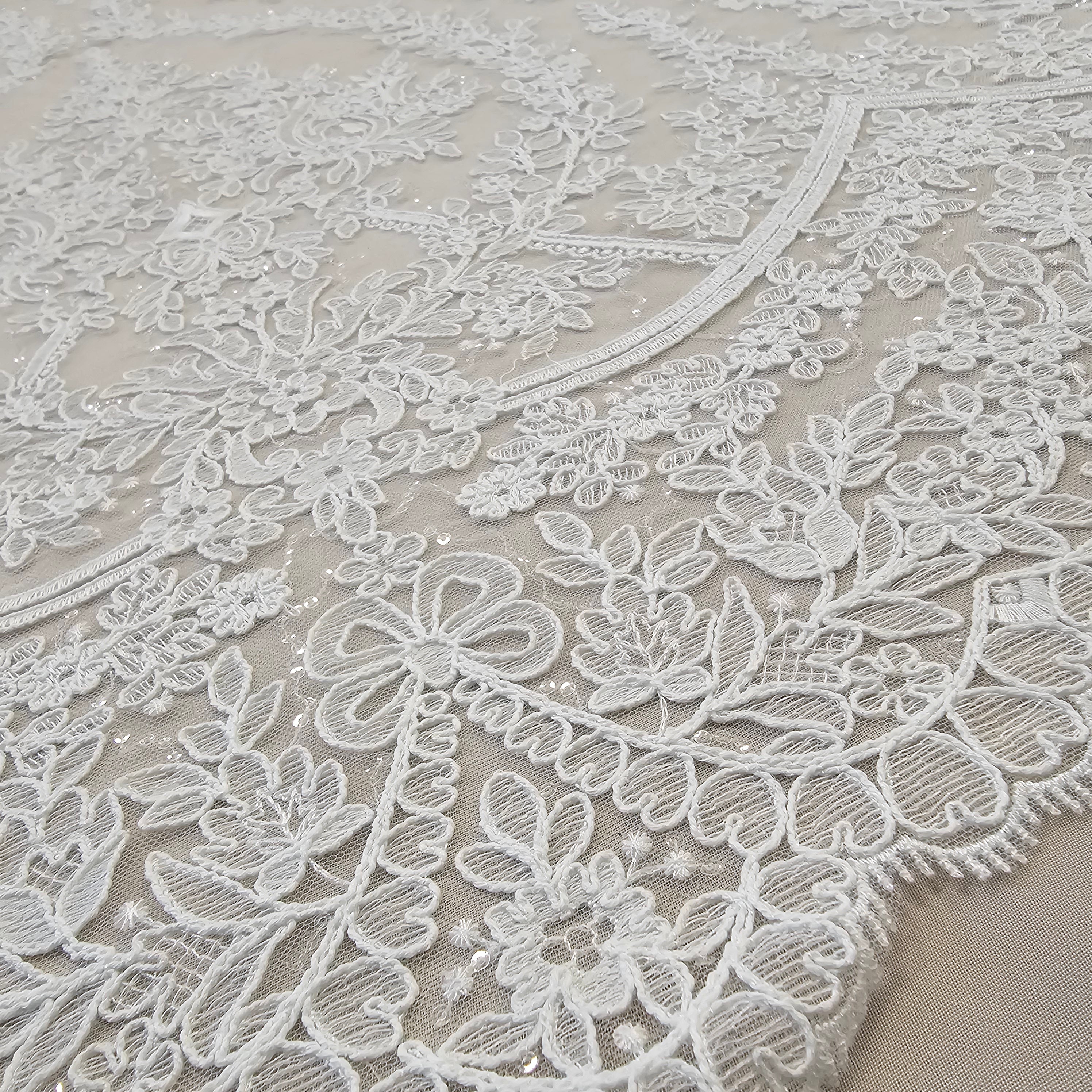 Ivory Embroidered Corded Tulle — featuring scalloped edges and a corded texture, 60% rayon 40% nylon, 130cm wide