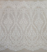 Ivory Embroidered Corded Tulle — featuring scalloped edges and a corded texture, 60% rayon 40% nylon, 130cm wide