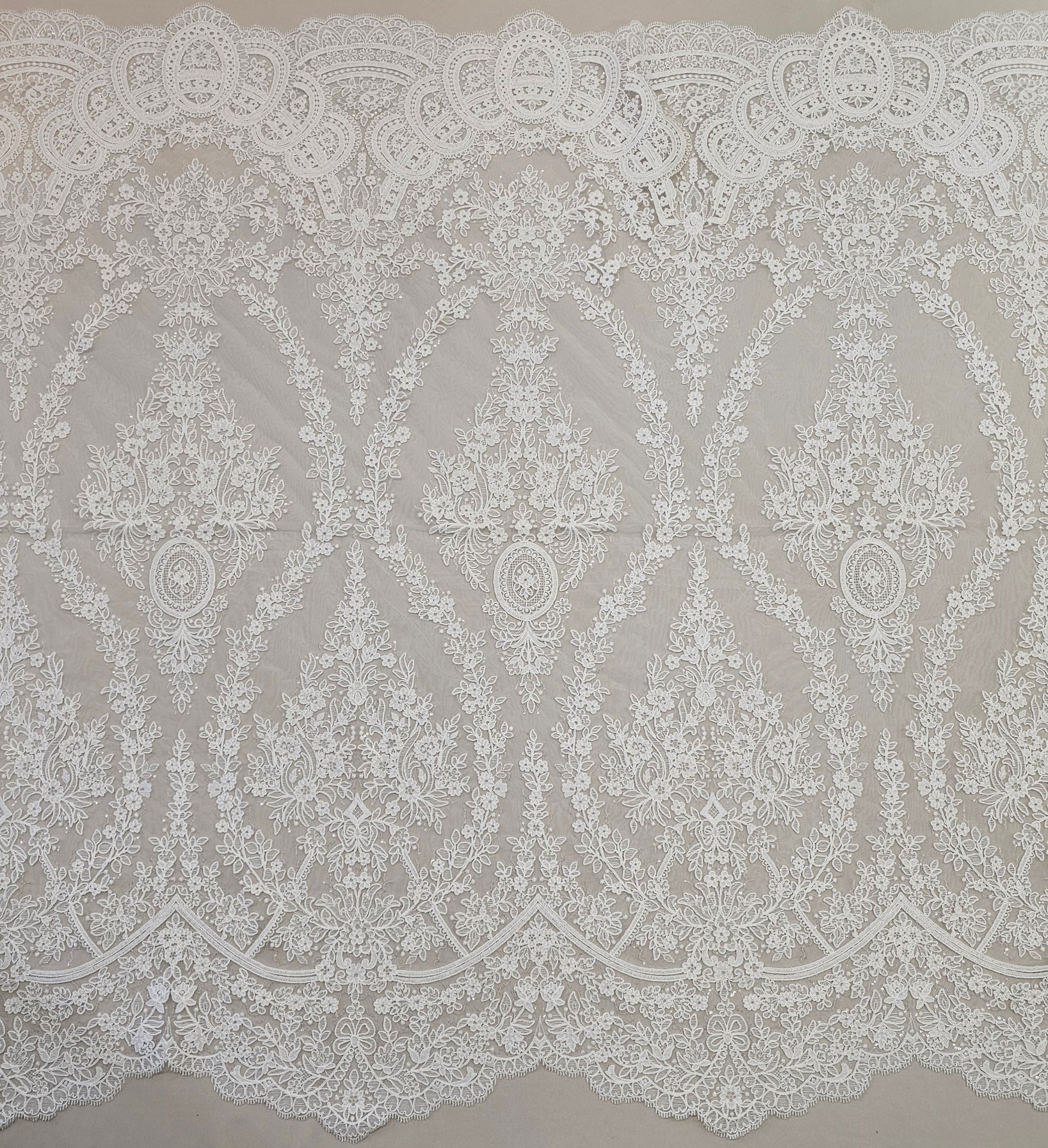 Ivory Embroidered Corded Tulle — featuring scalloped edges and a corded texture, 60% rayon 40% nylon, 130cm wide