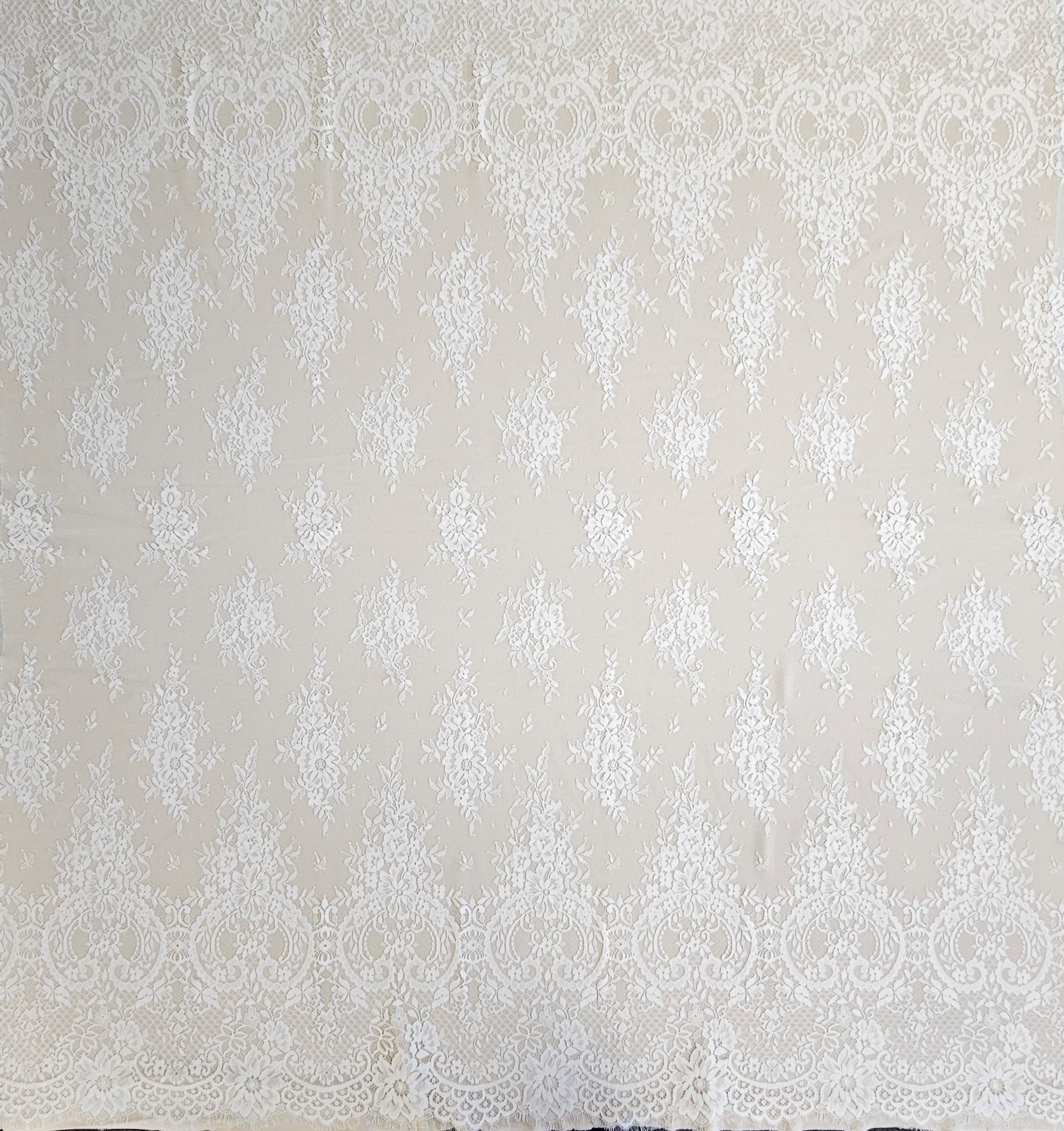 Ivory Fine Floral Lace — featuring scalloped edges, eyelash detail and floral motifs, 130cm wide