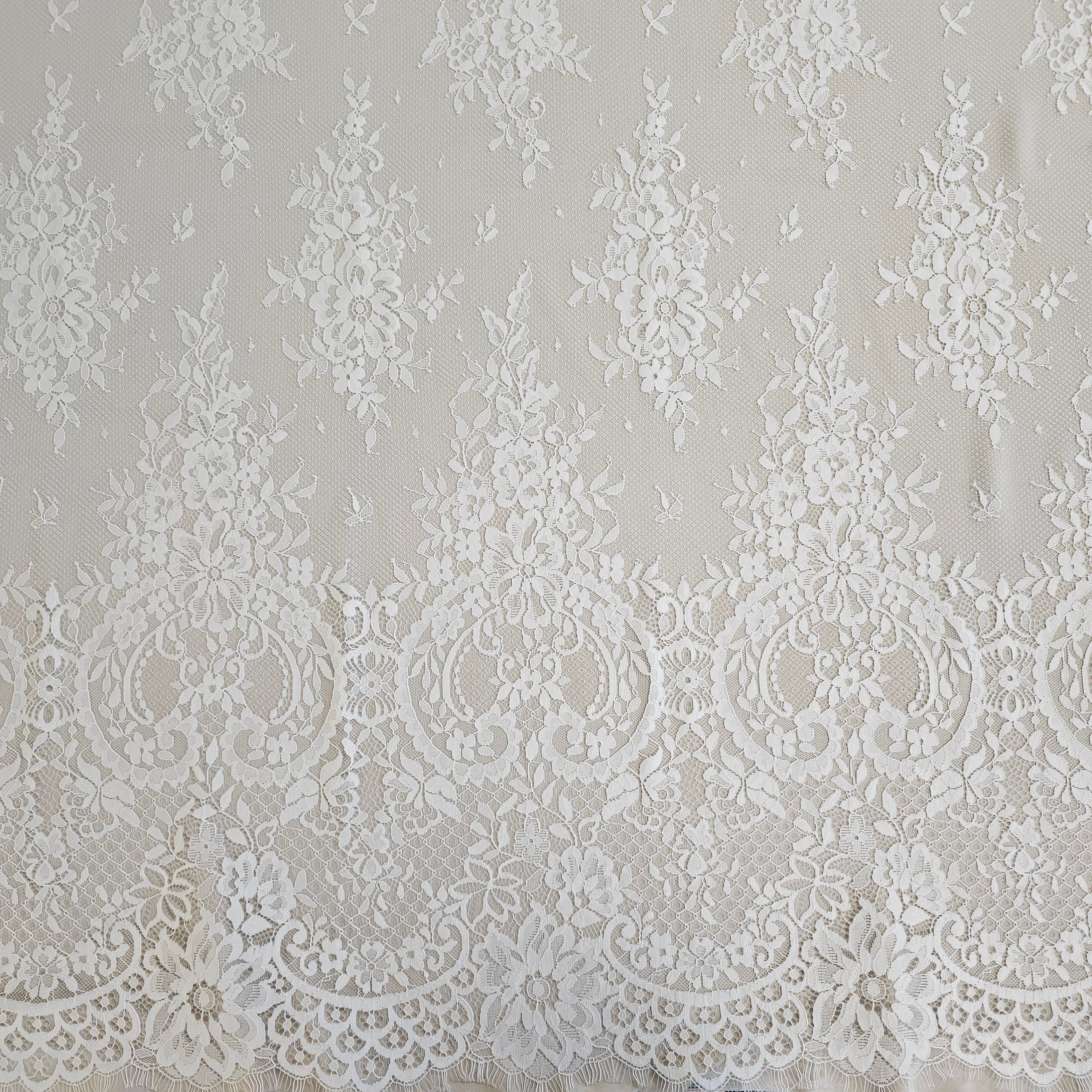 Ivory Fine Floral Lace — featuring scalloped edges, eyelash detail and floral motifs, 130cm wide