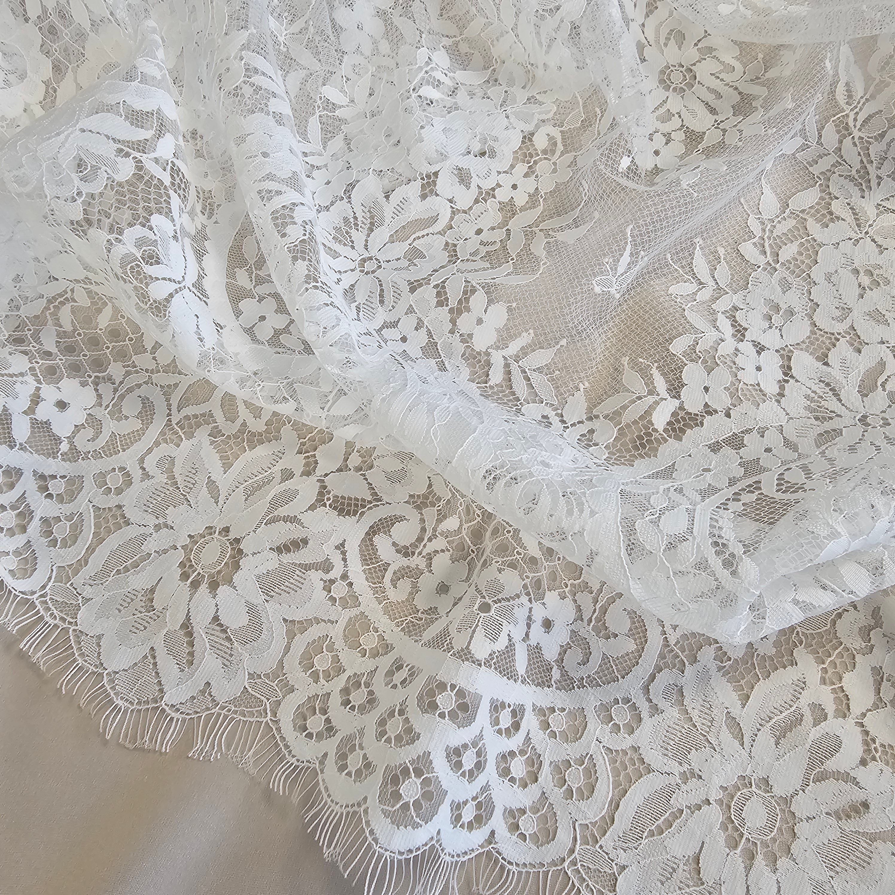 Ivory Fine Floral Lace — featuring scalloped edges, eyelash detail and floral motifs, 130cm wide
