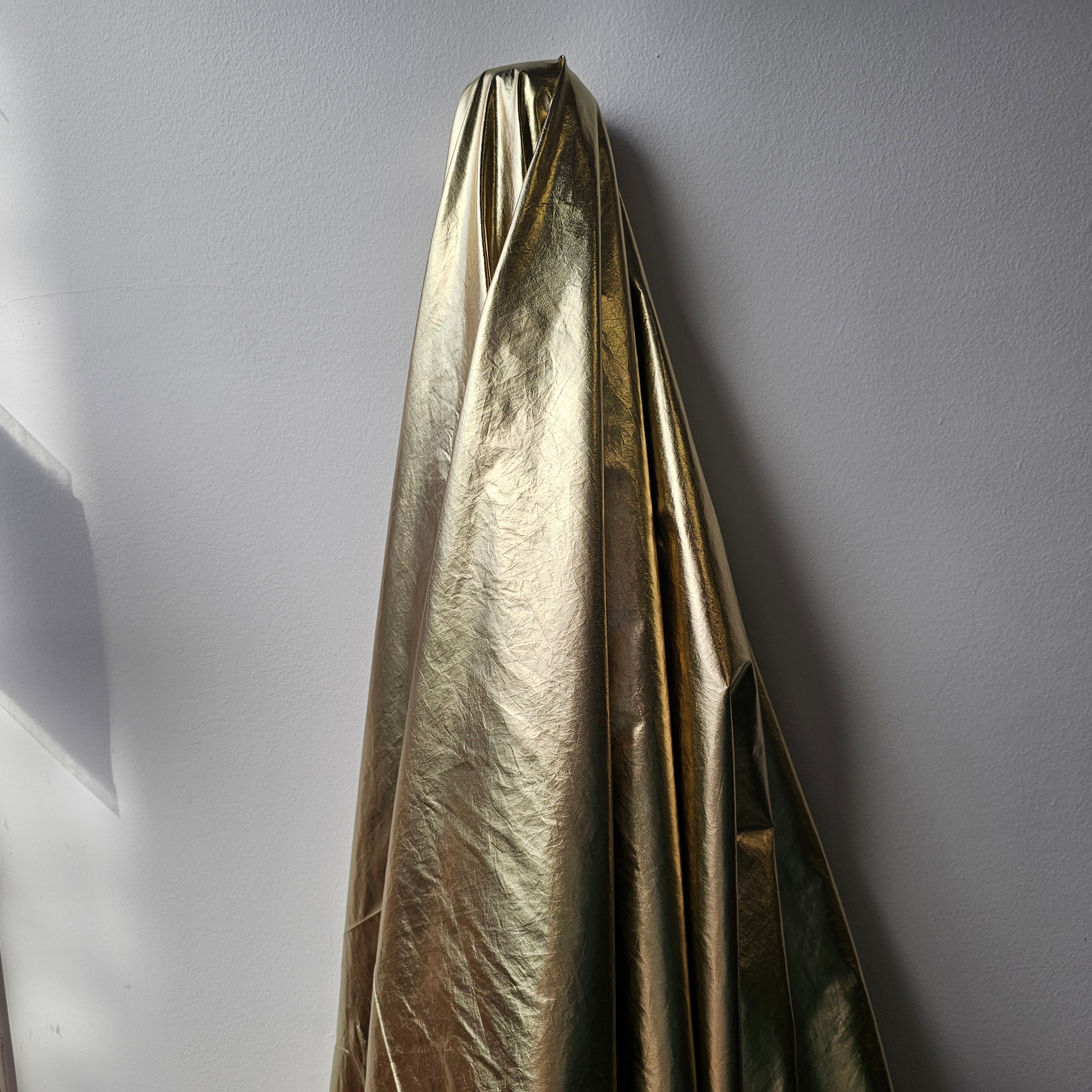 Gold Metallic Crushed Foil — a crushed fabric with a metallic foil finish