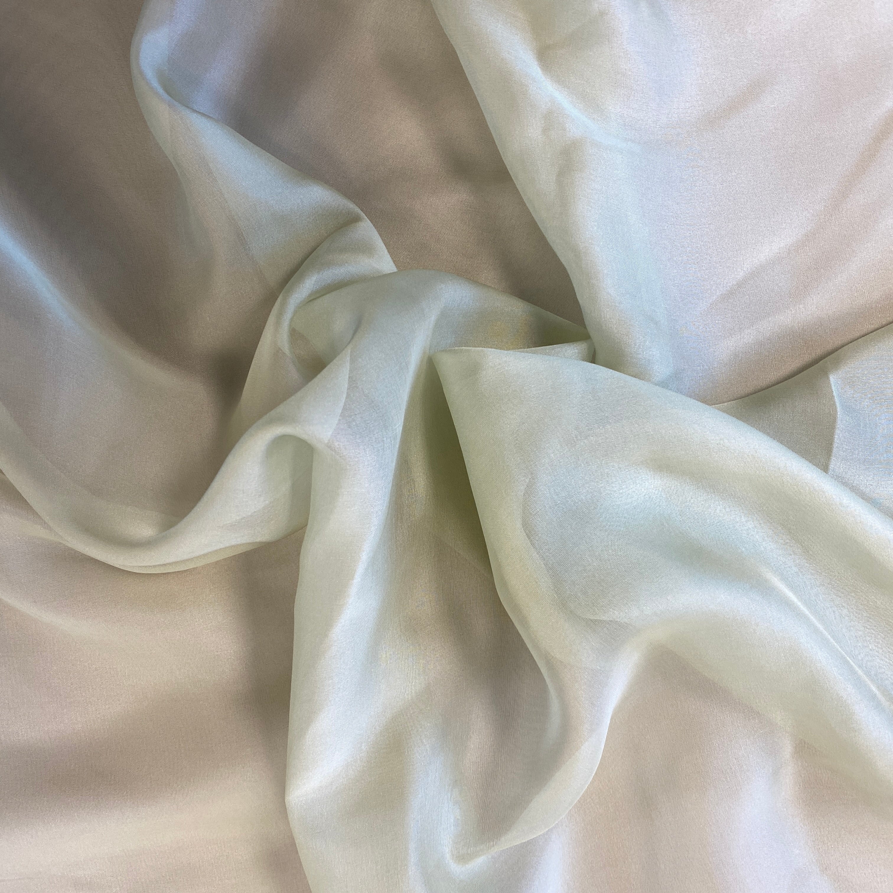 Sage Satin Chiffon — lightweight and sheer with a fluid, airy drape and a smooth satin luster finish, 100% mulberry silk, 140cm wide