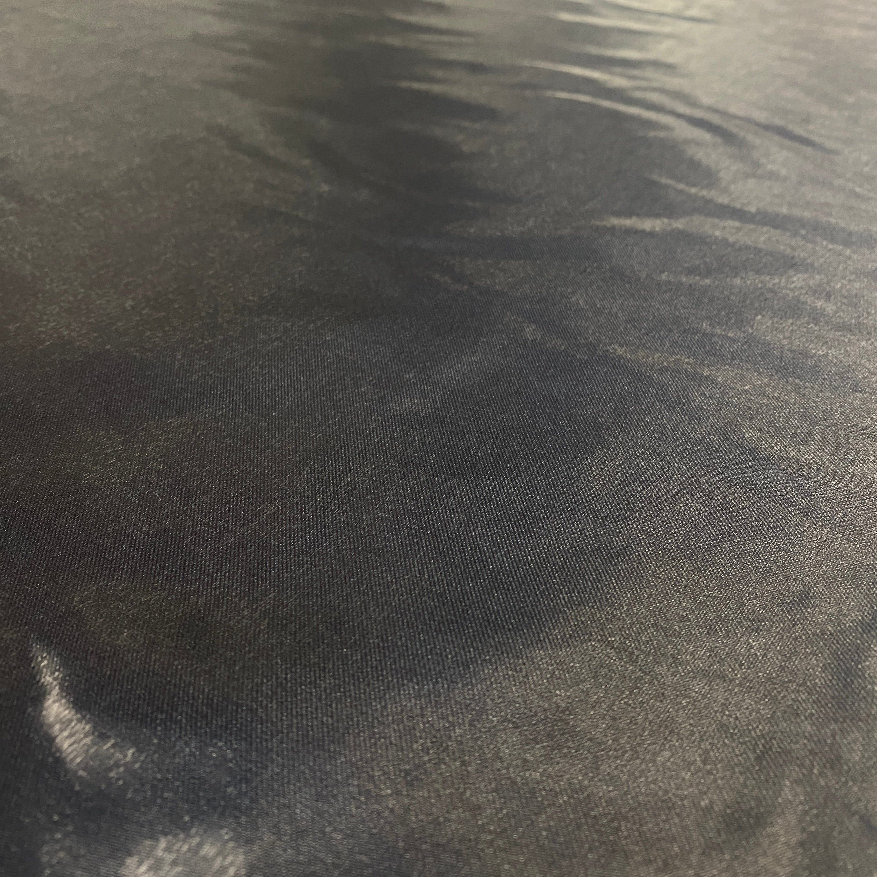 Black Liquid Satin — smooth and glossy with a liquid, wet-look shimmer, 100% polyester, 150cm wide