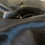 Black Liquid Satin — smooth and glossy with a liquid, wet-look shimmer, 100% polyester, 150cm wide