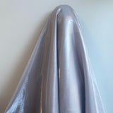 Silver Liquid Satin — smooth and glossy with a liquid, wet-look shimmer, 100% polyester, 150cm wide