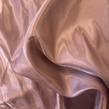 Tea Rose Liquid Satin — smooth and glossy with a liquid, wet-look shimmer, 100% polyester, 150cm wide