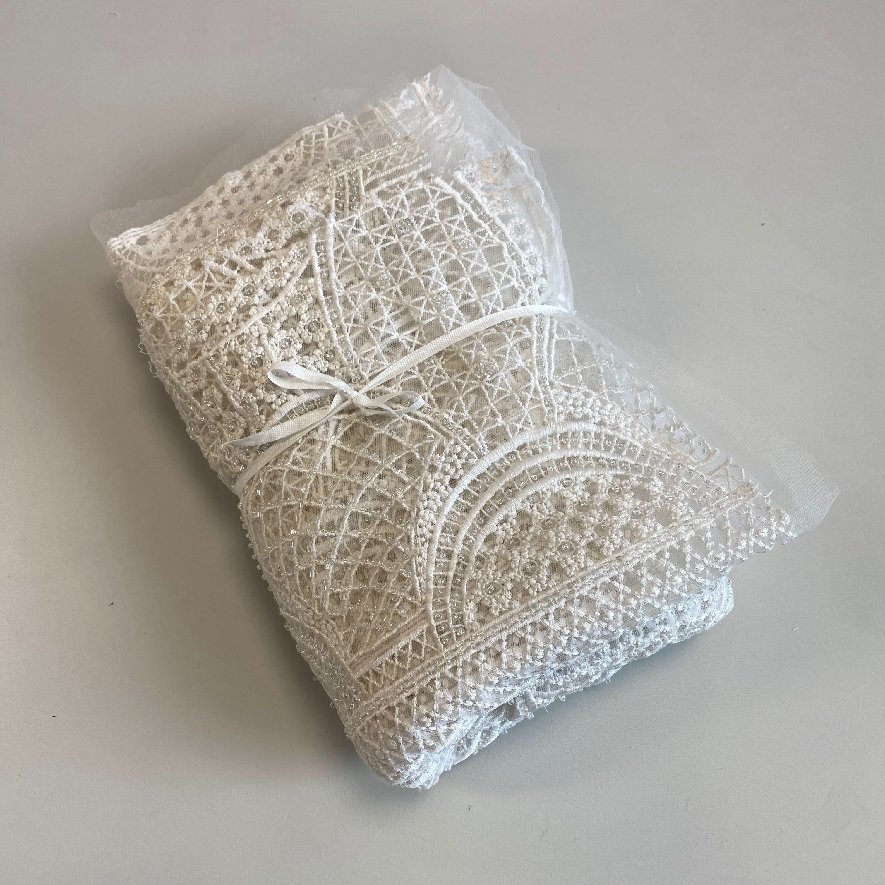 Ivory Geometric Embellished Tulle — featuring geometric motifs and hand-beading, 100% nylon, 110cm wide