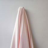 Pale Pink Stretch Polyester Lining — lightweight with a satin finish, matte reverse and gentle stretch, in polyester