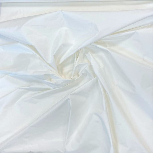 White Taffeta — a mid-weight silk taffeta with a smooth texture and crisp handle, 100% silk