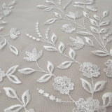 Ivory Embroidered Tulle — featuring a border design, 50% nylon 50% rayon, 135cm wide