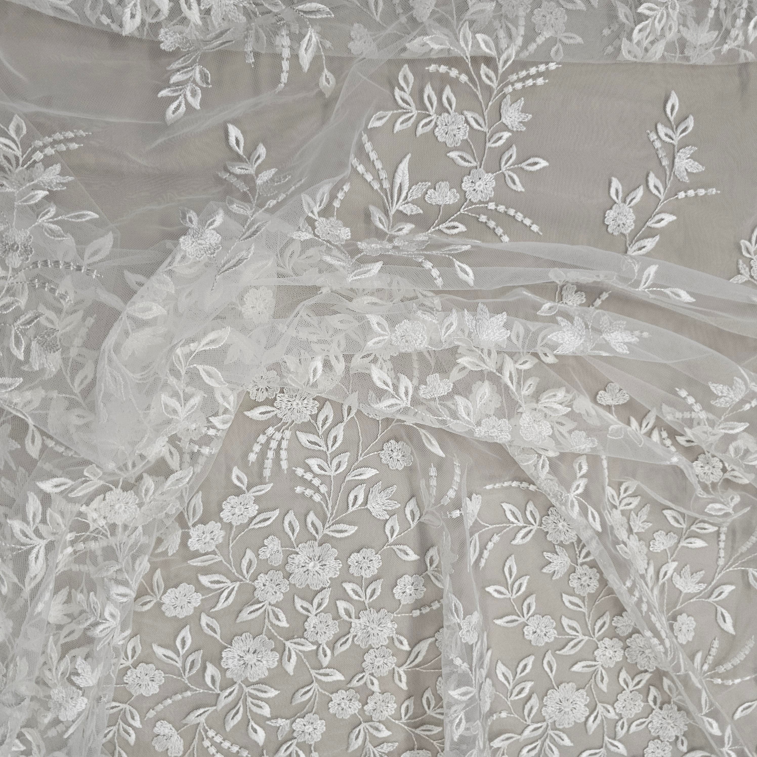 Ivory Embroidered Tulle — featuring a border design, 50% nylon 50% rayon, 135cm wide