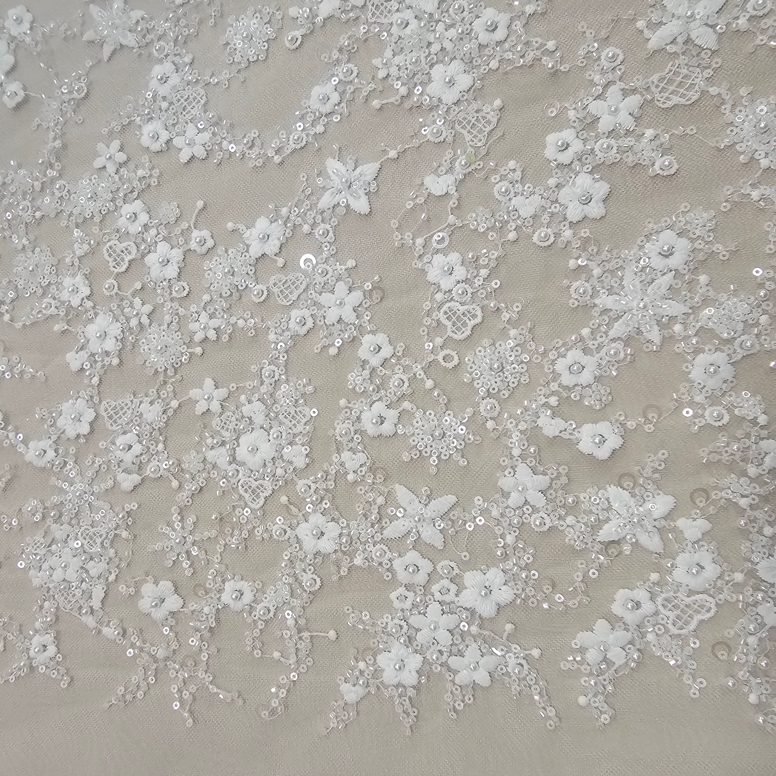 Ivory Sequined Tulle — featuring floral motifs, hand-beading and sequins, 60% rayon 40% nylon, 140cm wide