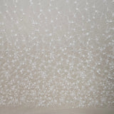 Ivory Sequined Tulle — featuring floral motifs, hand-beading and sequins, 60% rayon 40% nylon, 140cm wide