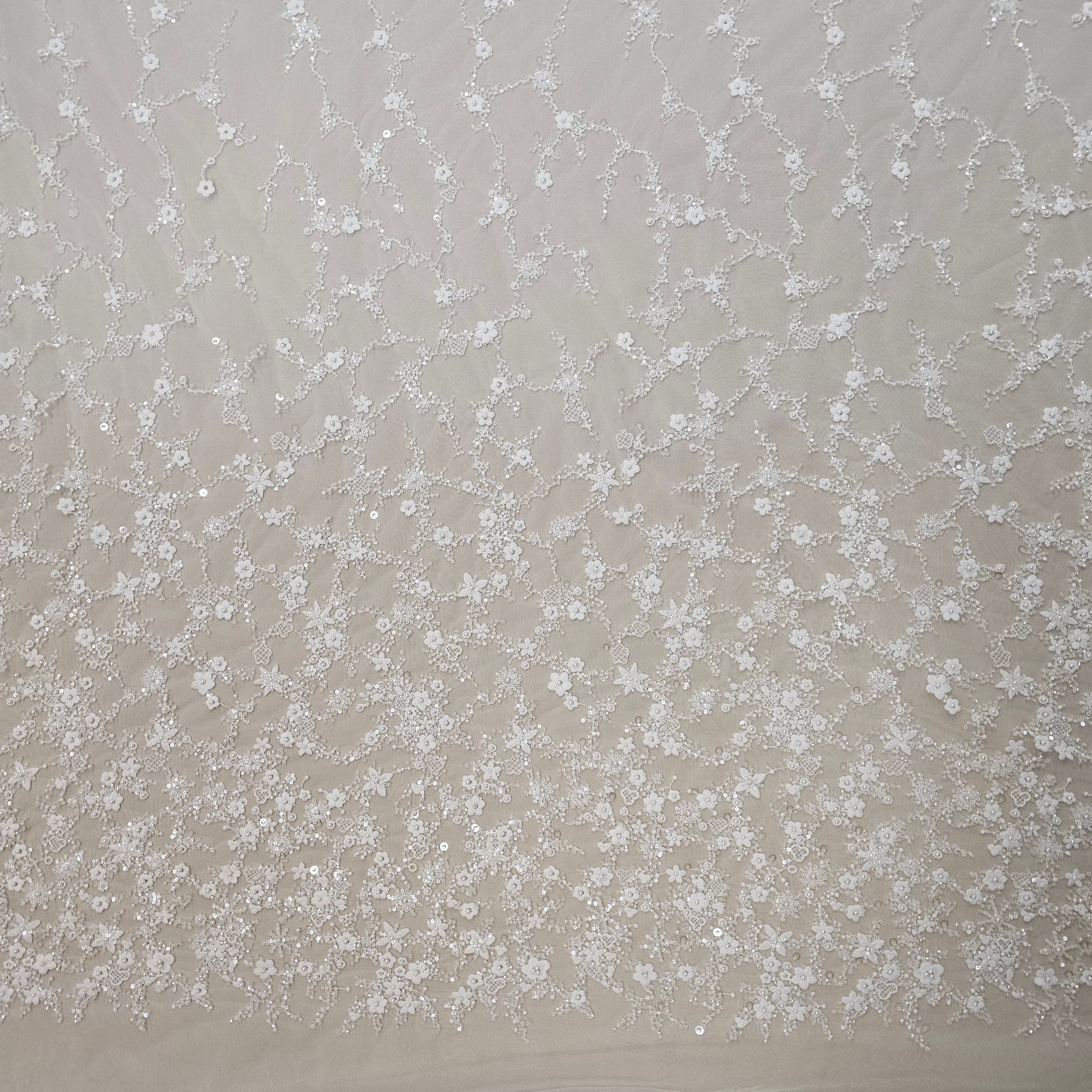 Ivory Sequined Tulle — featuring floral motifs, hand-beading and sequins, 60% rayon 40% nylon, 140cm wide