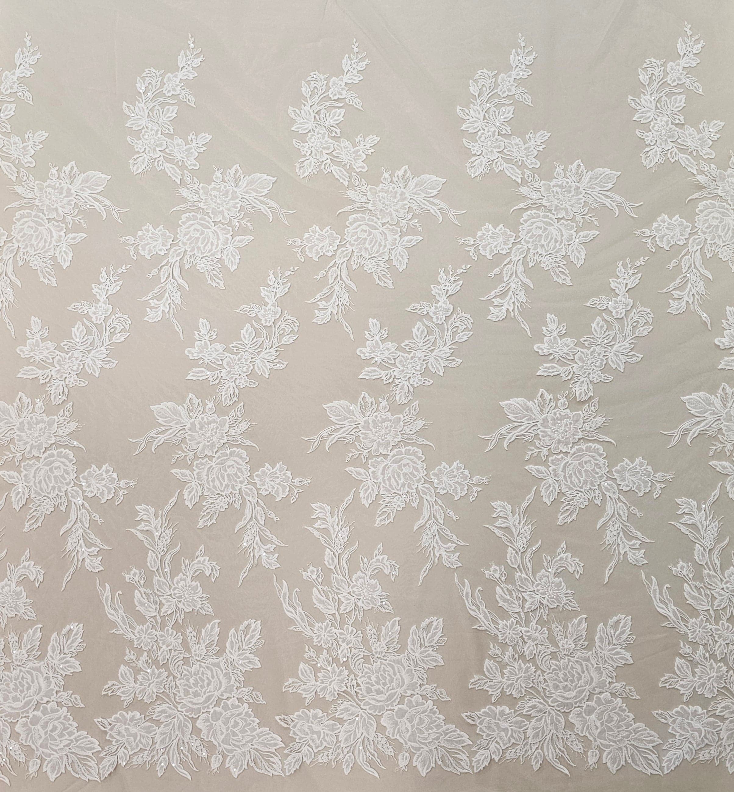 Ivory Floral Embroidered Tulle — featuring floral motifs and a border design, 60% rayon 40% nylon, 140cm wide