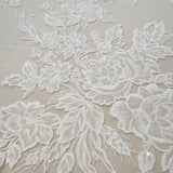 Ivory Floral Embroidered Tulle — featuring floral motifs and a border design, 60% rayon 40% nylon, 140cm wide
