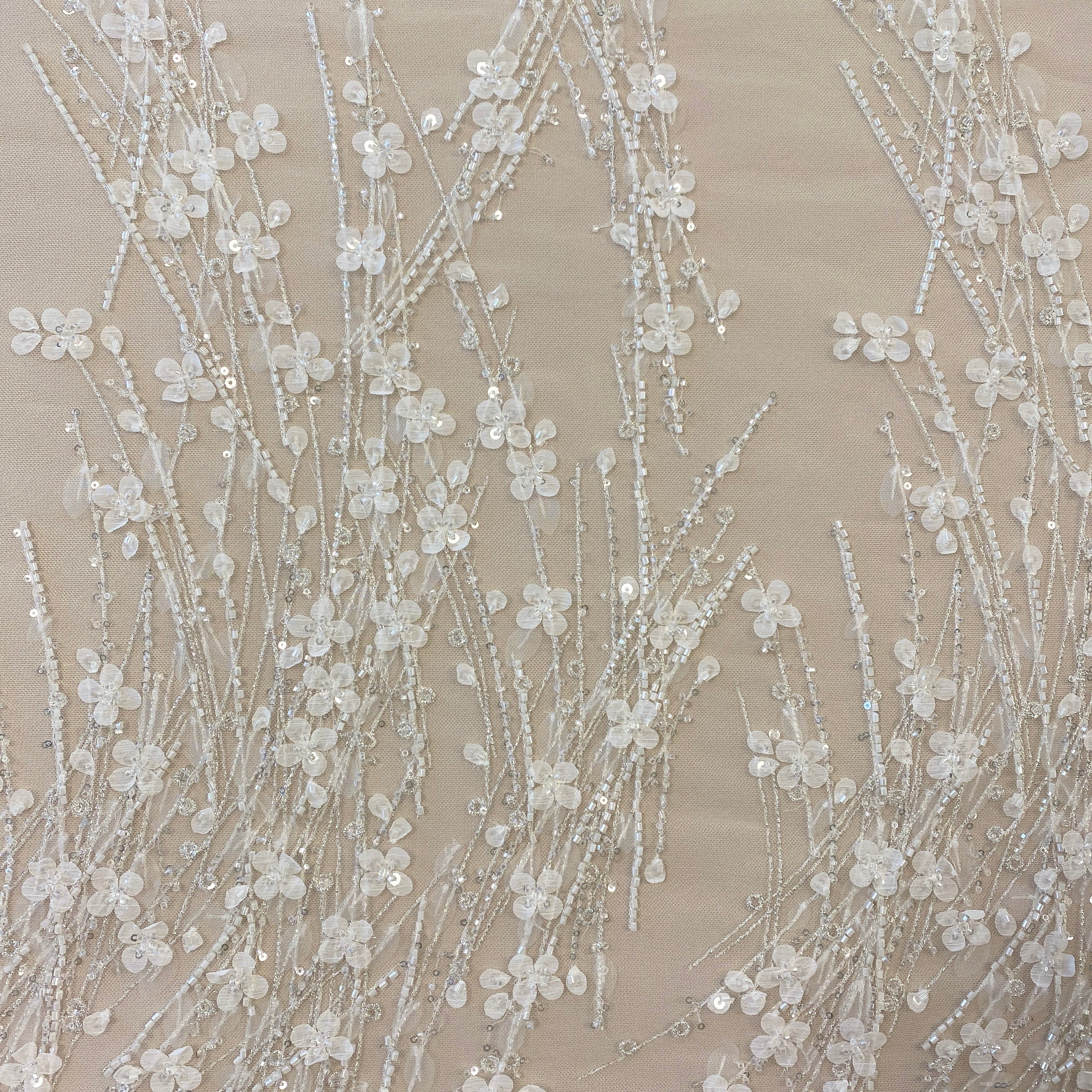 Ivory / Silver 3D Floral Blossom Embroidered Tulle — featuring floral motifs, a 3D floral design and hand-beading, 60% rayon 40% nylon, 140cm wide