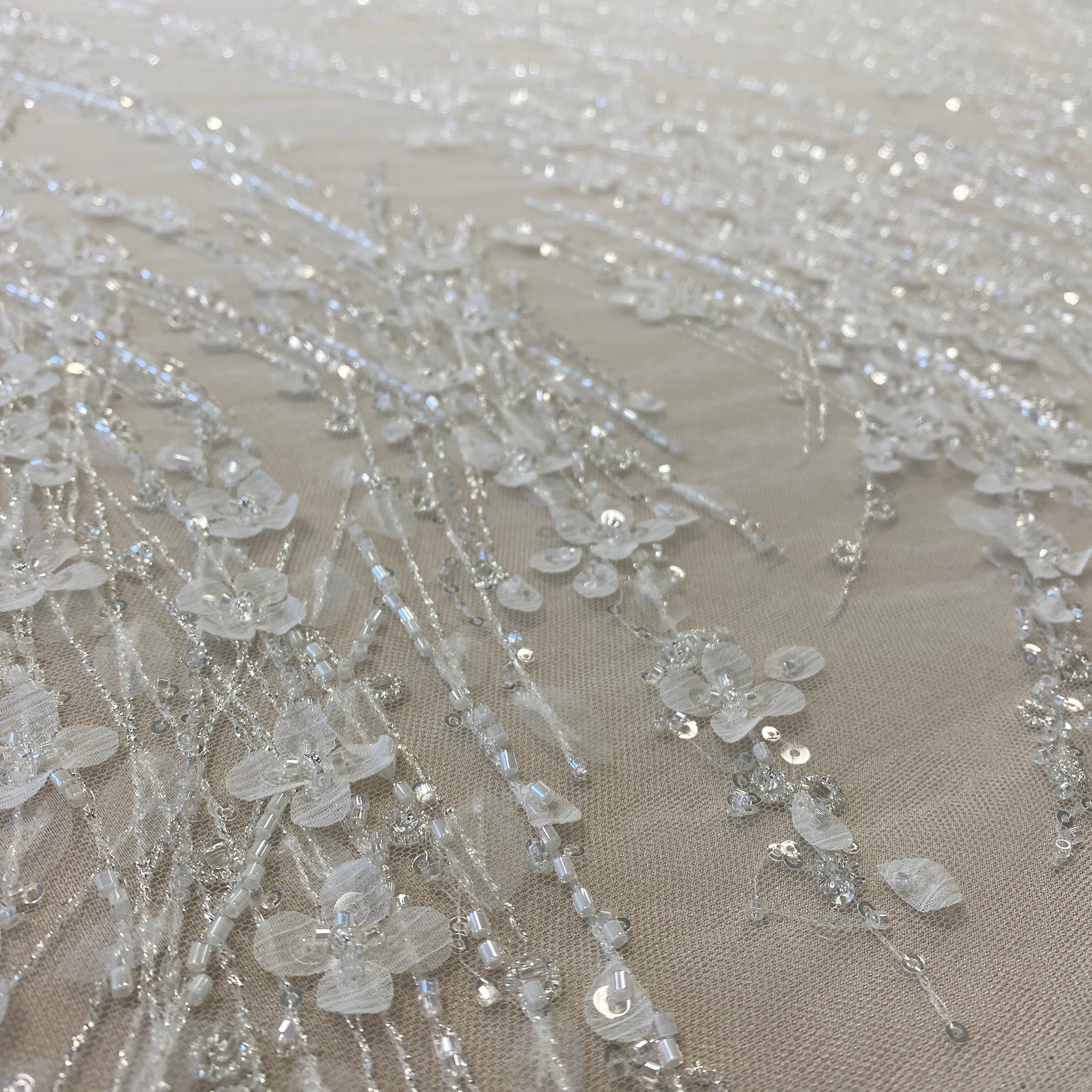 Ivory / Silver 3D Floral Blossom Embroidered Tulle — featuring floral motifs, a 3D floral design and hand-beading, 60% rayon 40% nylon, 140cm wide