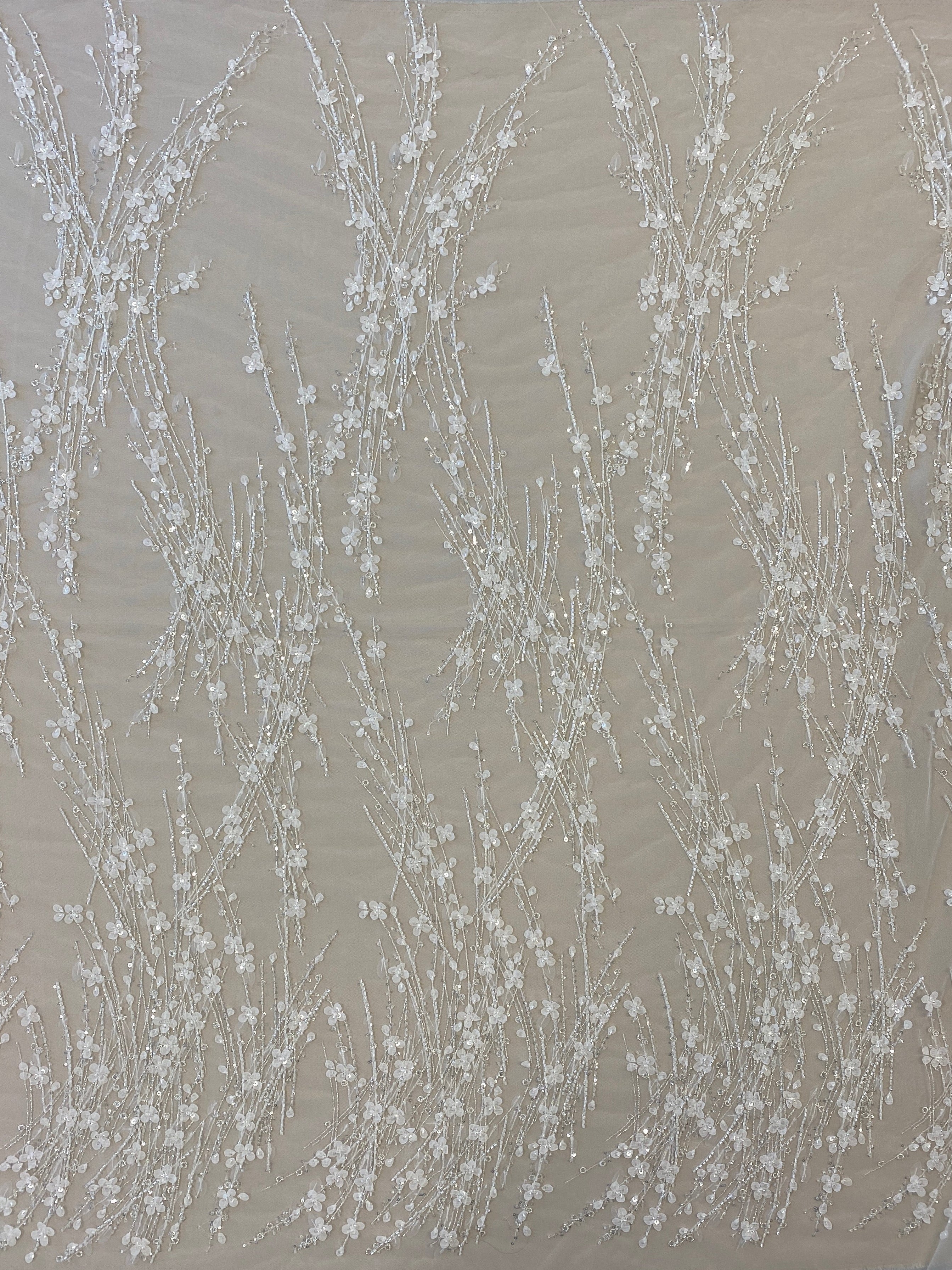 Ivory / Silver 3D Floral Blossom Embroidered Tulle — featuring floral motifs, a 3D floral design and hand-beading, 60% rayon 40% nylon, 140cm wide
