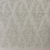 Ivory / Silver Embellished Tulle — featuring a leaf design and hand-beading, 60% rayon 40% nylon, 140cm wide