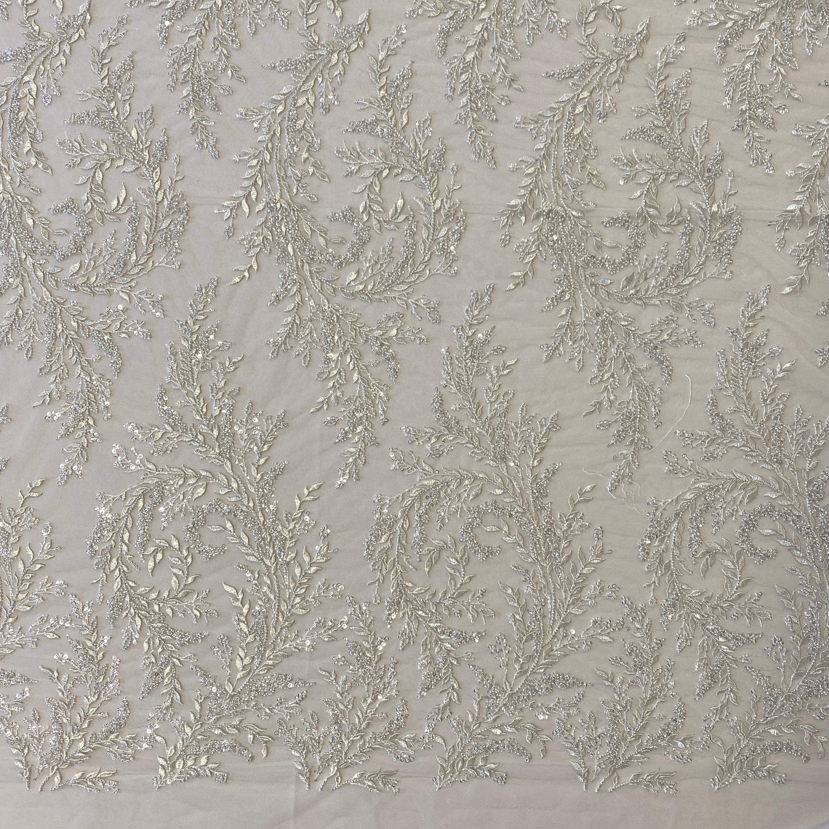Ivory / Silver Embellished Tulle — featuring a leaf design and hand-beading, 60% rayon 40% nylon, 140cm wide