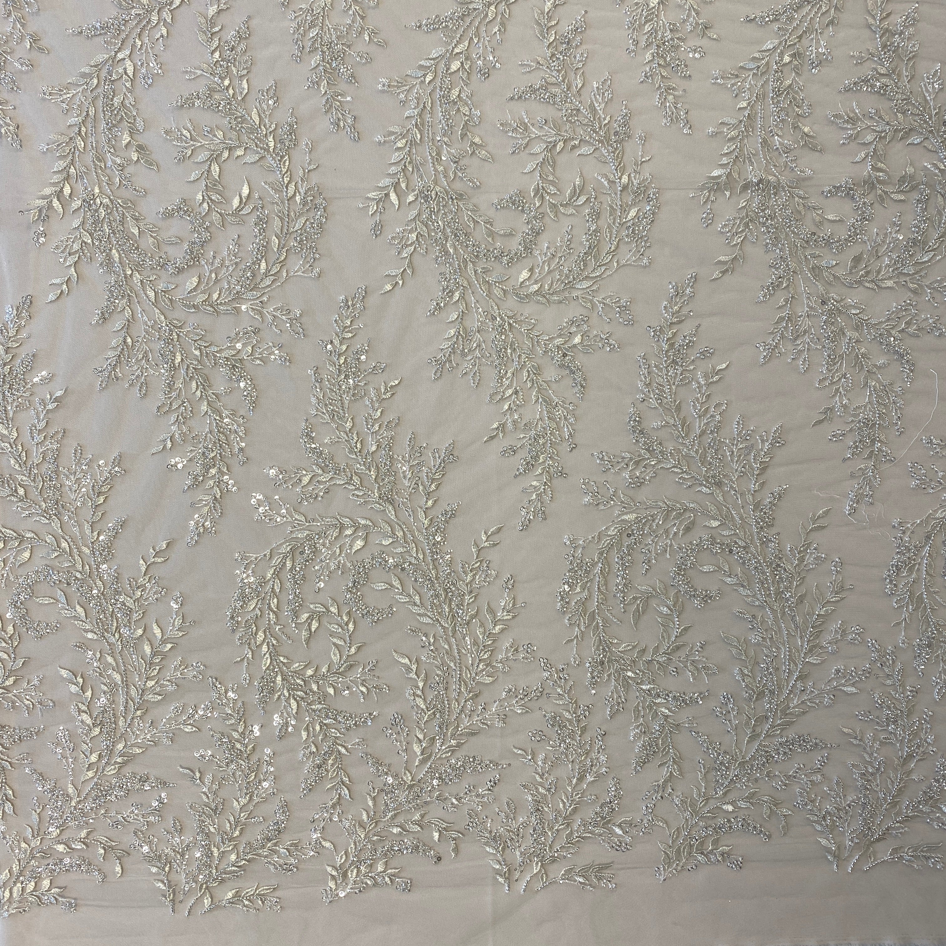 Ivory / Silver Embellished Tulle — featuring a leaf design and hand-beading, 60% rayon 40% nylon, 140cm wide