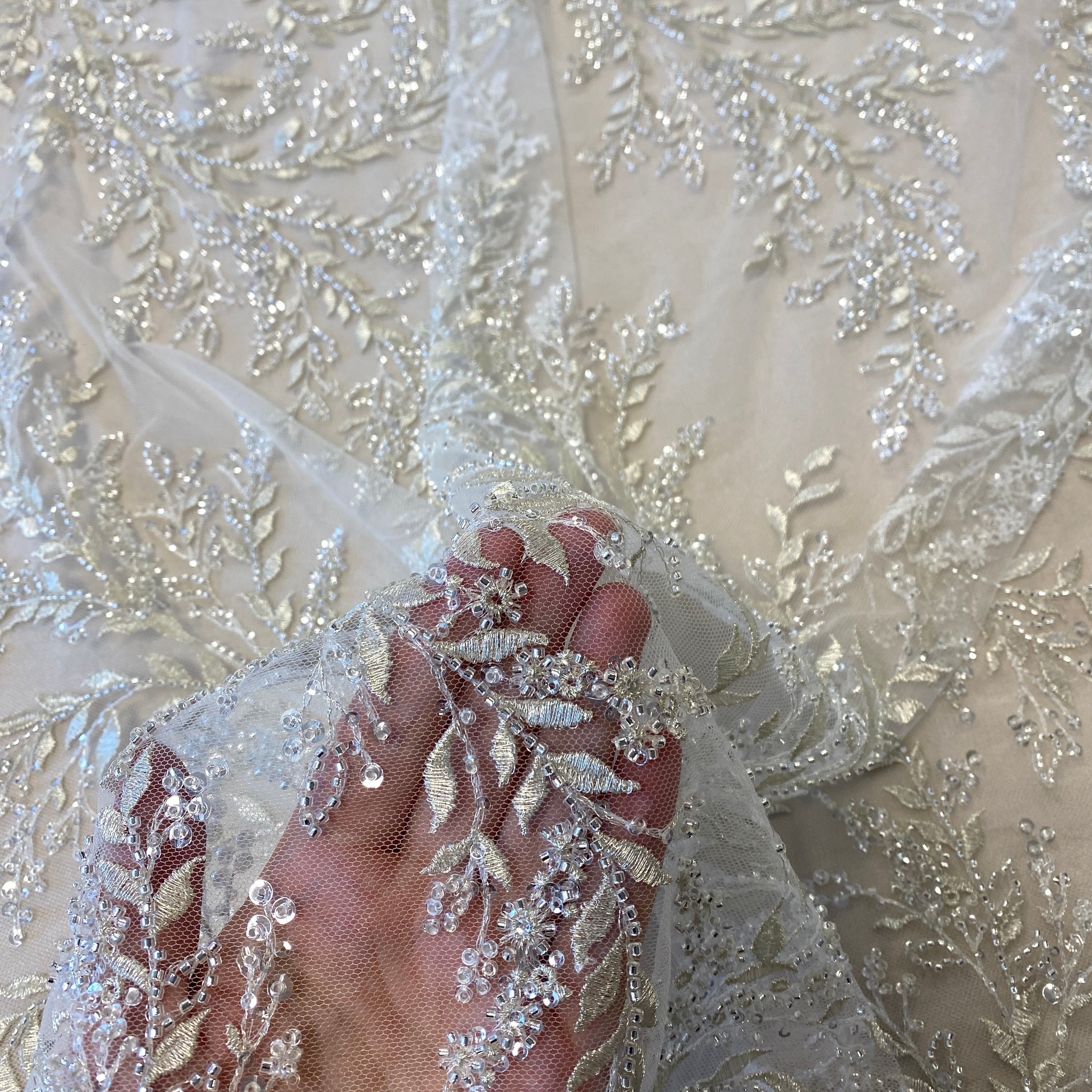 Ivory / Silver Embellished Tulle — featuring a leaf design and hand-beading, 60% rayon 40% nylon, 140cm wide