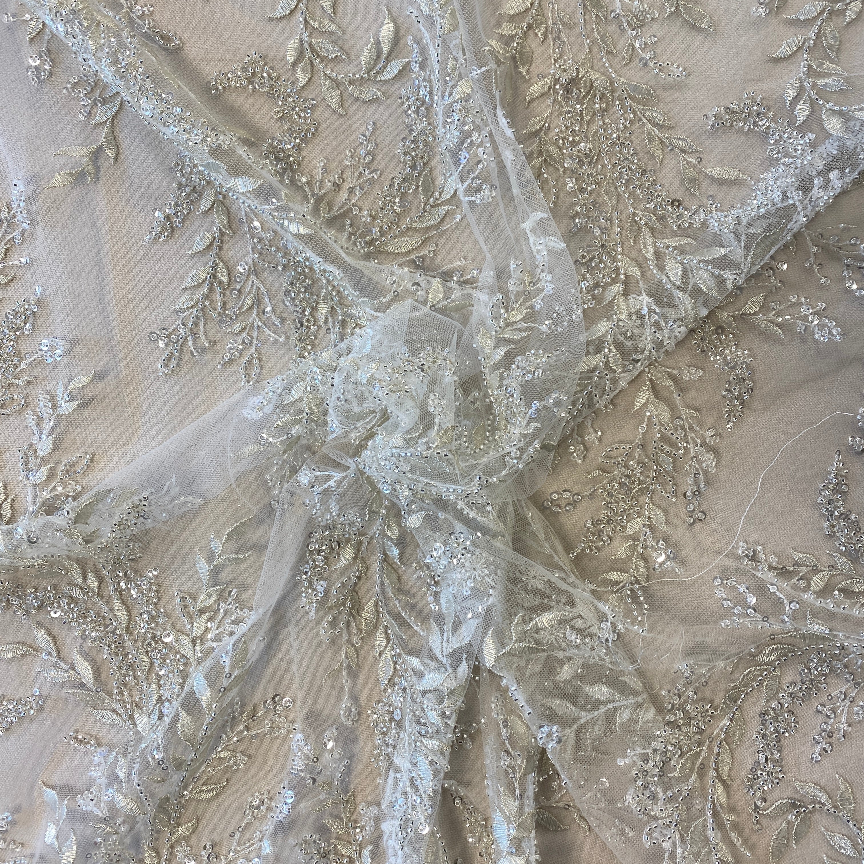 Ivory / Silver Embellished Tulle — featuring a leaf design and hand-beading, 60% rayon 40% nylon, 140cm wide