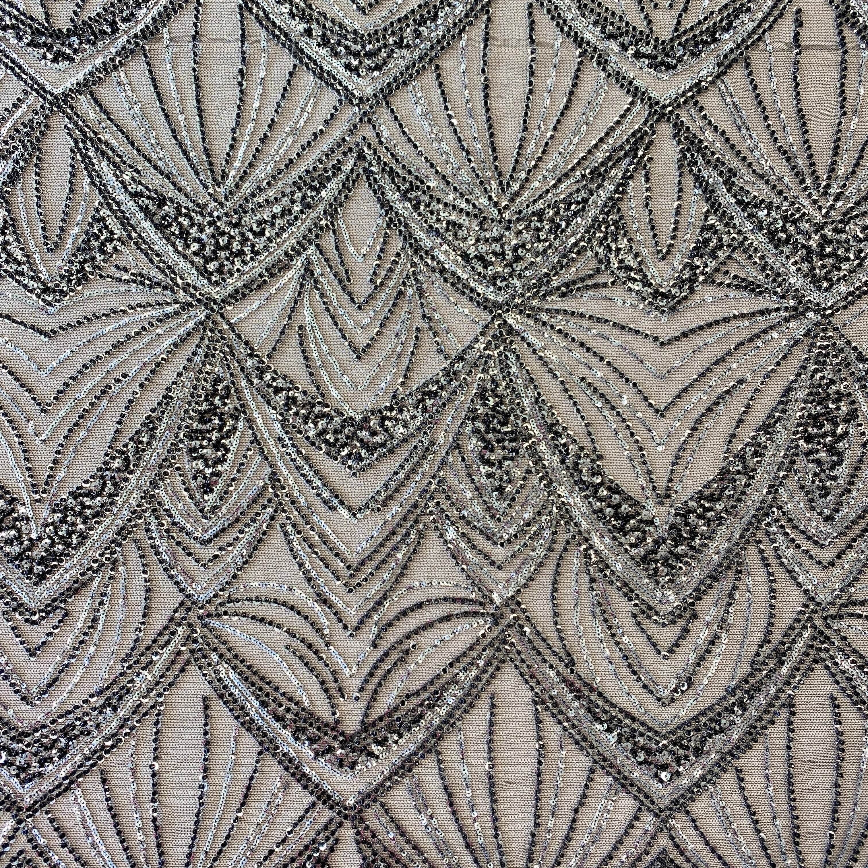 Black / Silver Embellished Tulle — featuring scalloped edges and hand-beading, 60% rayon 40% nylon, 130cm wide