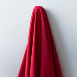 Deep Red Faux Acetate Satin — mid-weight double-faced polyester satin with a delustered finish, fluid drape and slight stretch